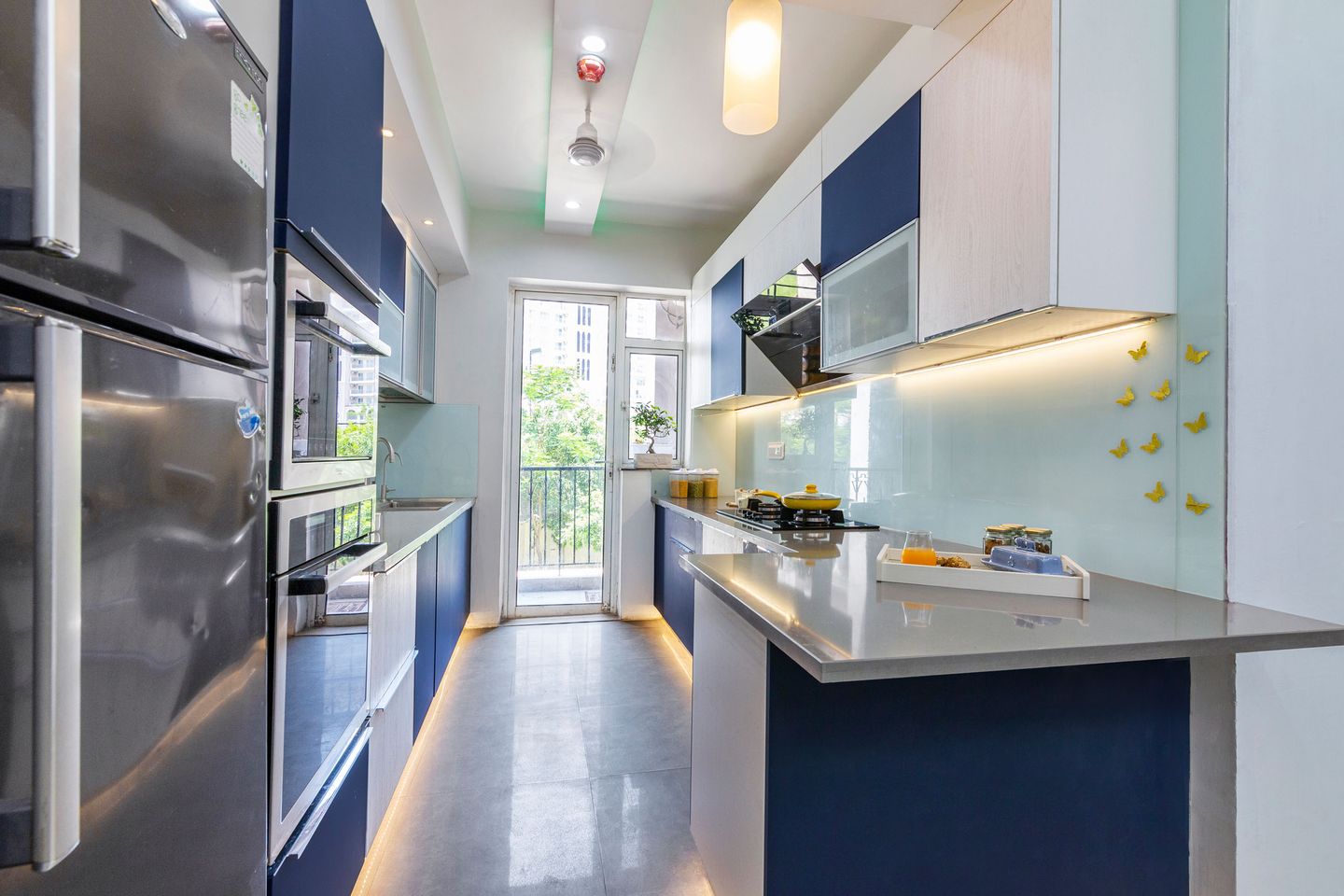 Contemporary Wave Blue And Oak Endgrain Delight Parallel Kitchen Design With Refrigerator - Livspace