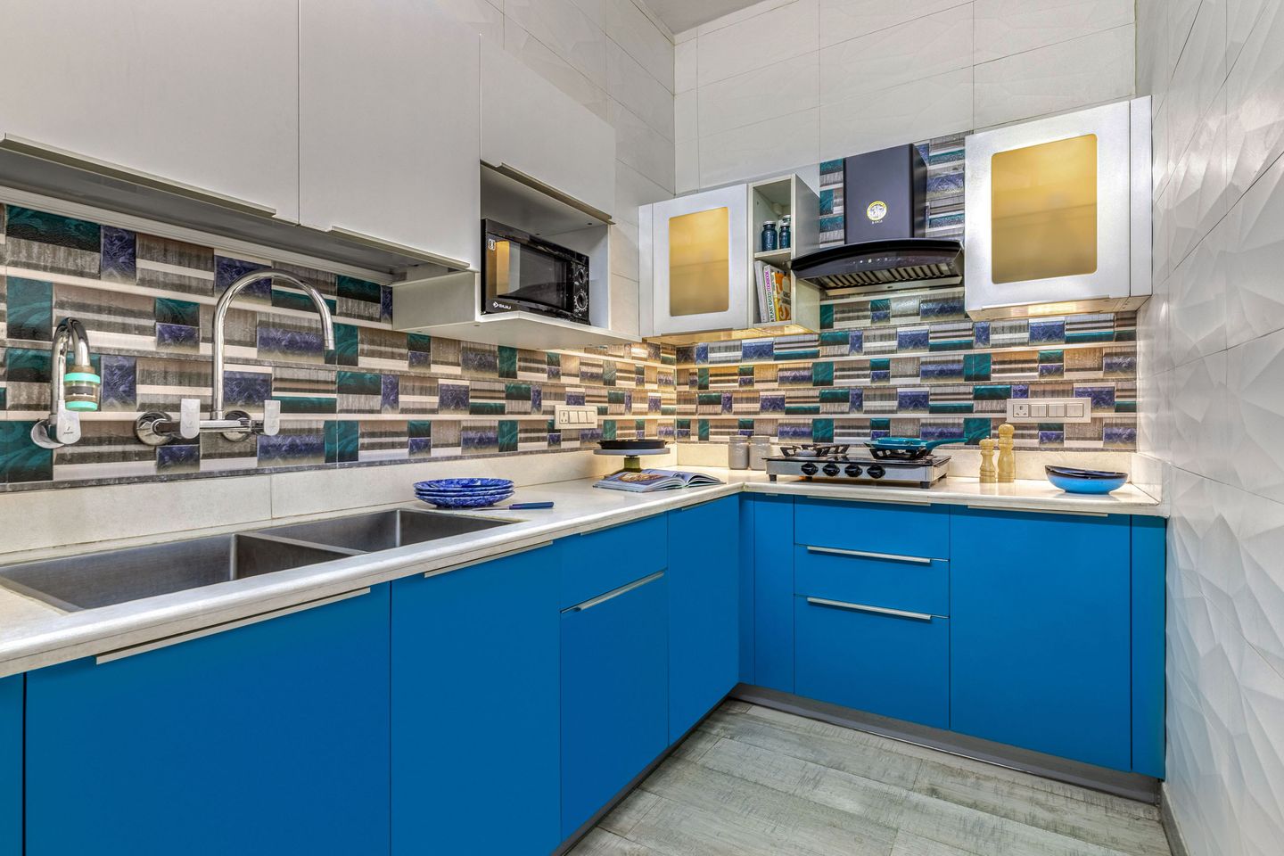 Blue And Grey Contemporary Kitchen Cabinet Design With Multicoloured Backsplash | Livspace