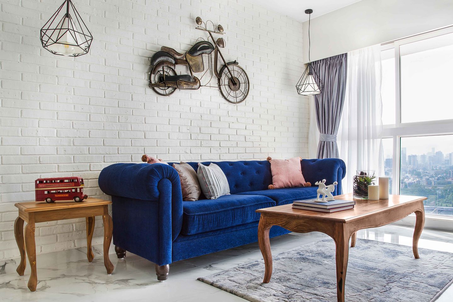 White Living Room Design With Dark Blue Sofa And Wooden Coffee Table ...
