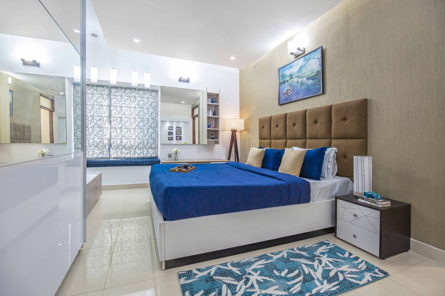 Master Bedroom With Bright Blue Queen-Size Bed And Brown Headboard, White And Wood Side Tables And Dressing Unit - Livspace