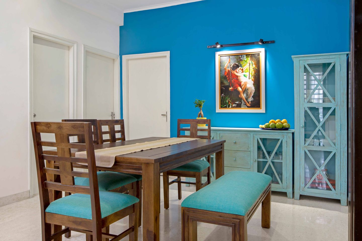 Wooden And Blue 4-Seater Dining Room Design With Blue Seater - Livspace