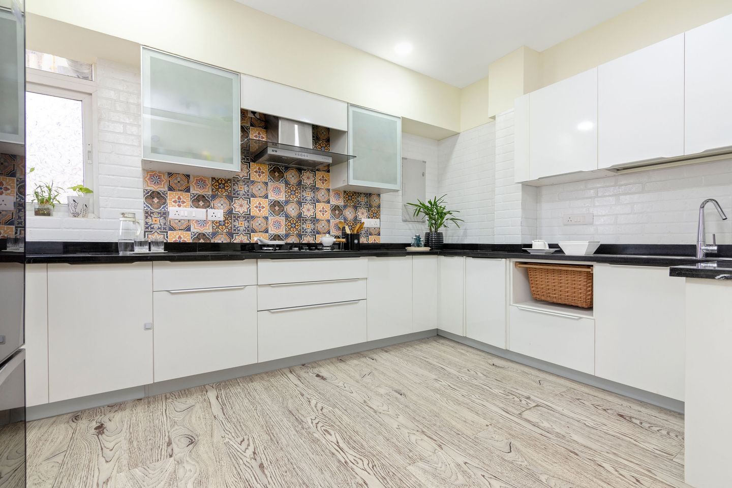 Glossy White U-Shaped Modular Kitchen Design With Granite Countertop - Livspace