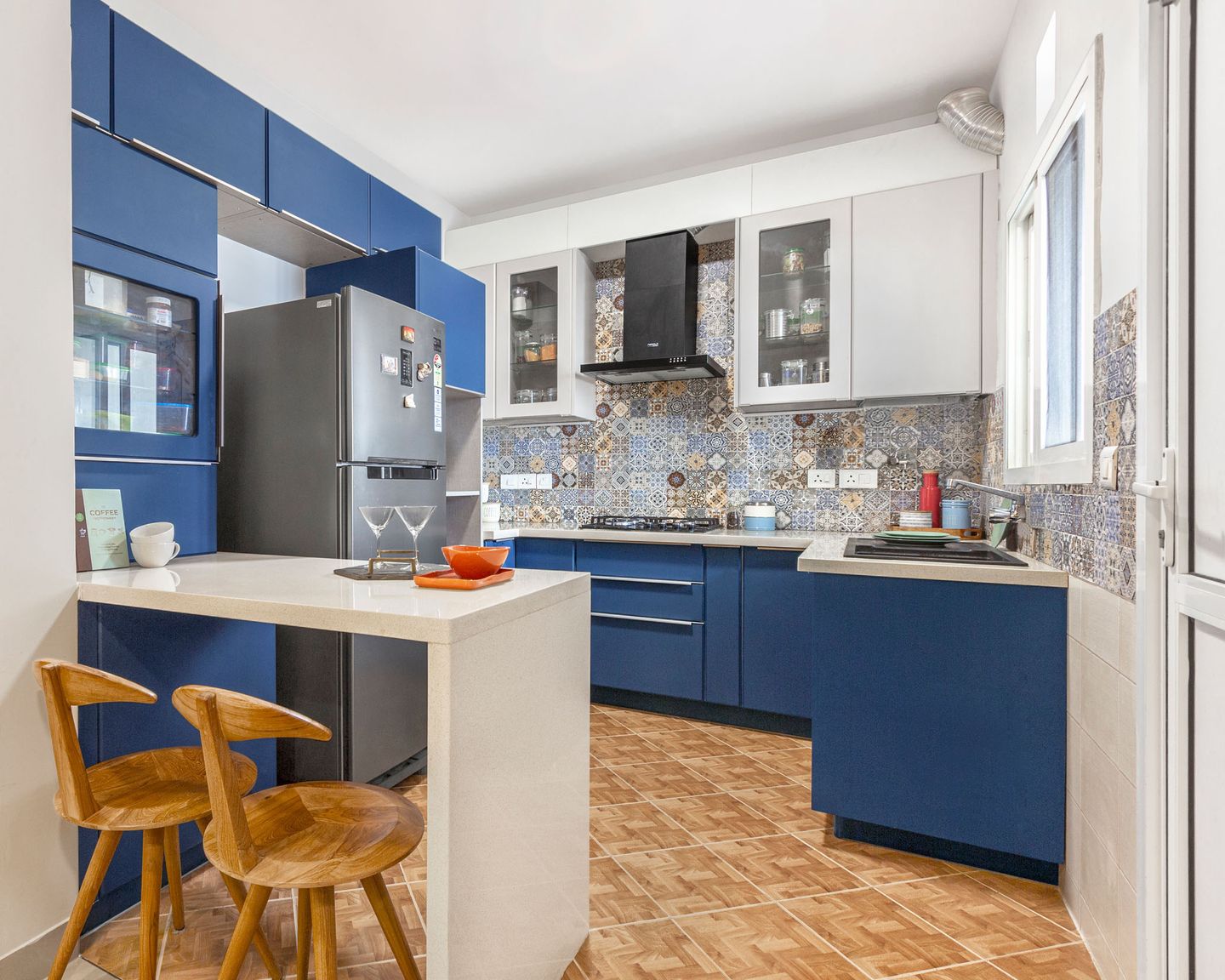 Blue And White Modular Island Kitchen Design With Patterned Backsplash - Livspace