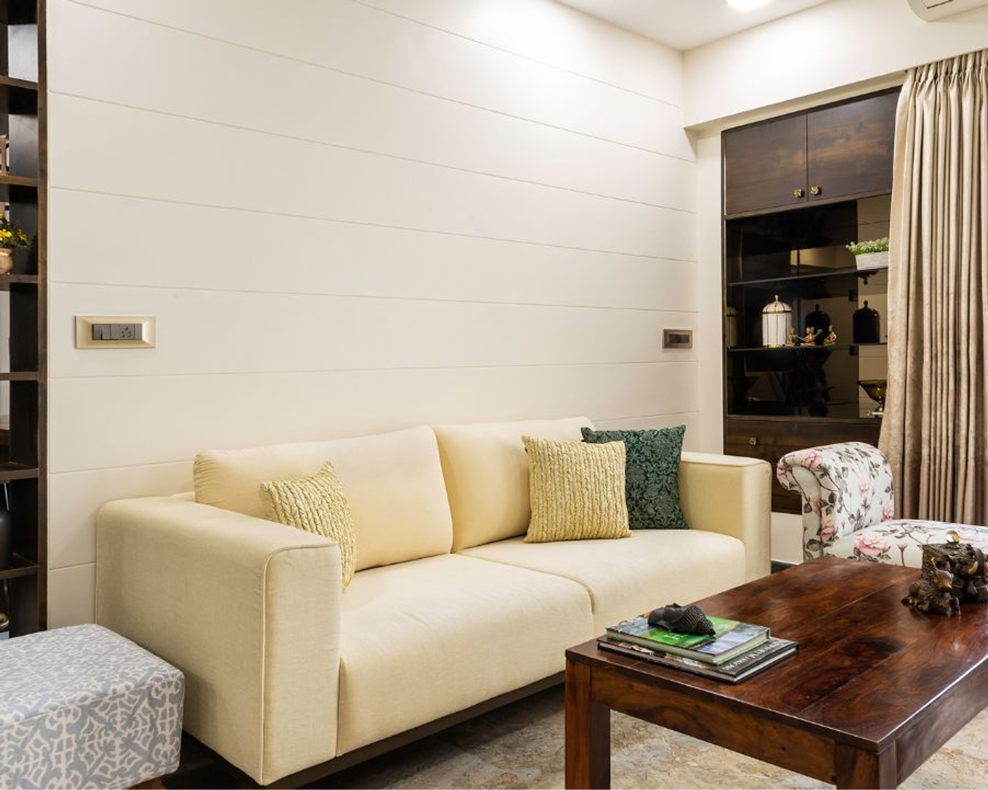 Light-Coloured Living Room Wall Paint With Wooden Details | Livspace