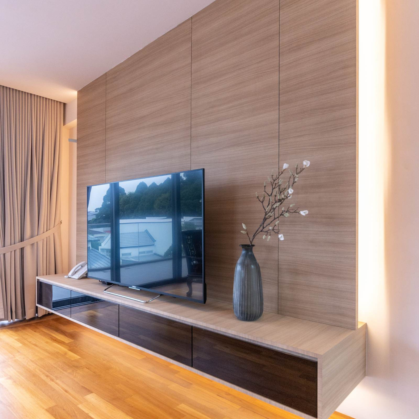 Brown Laminate Design For A TV Wall Backdrop | Livspace