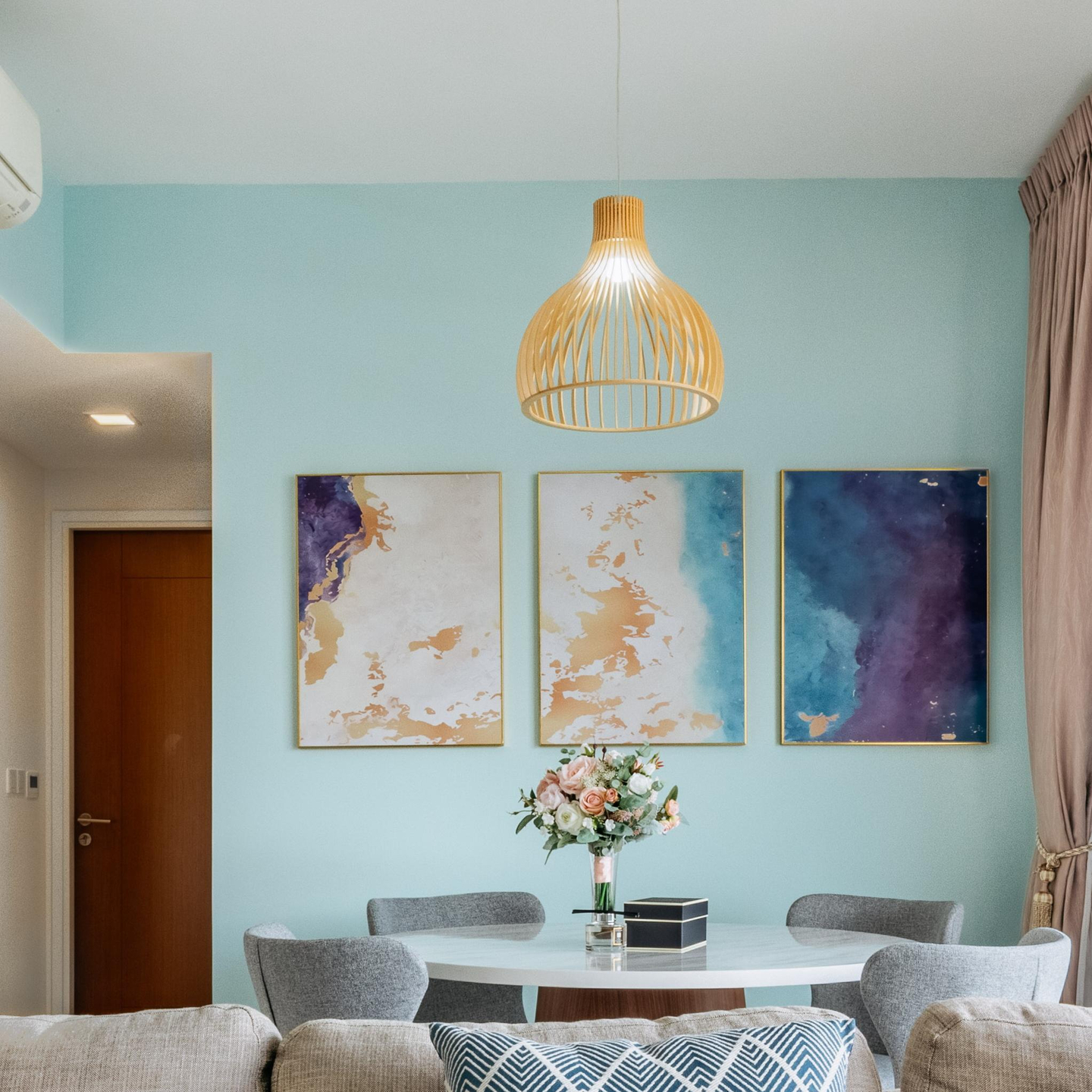Modern Pastel Blue Wall Design With Picture Frames