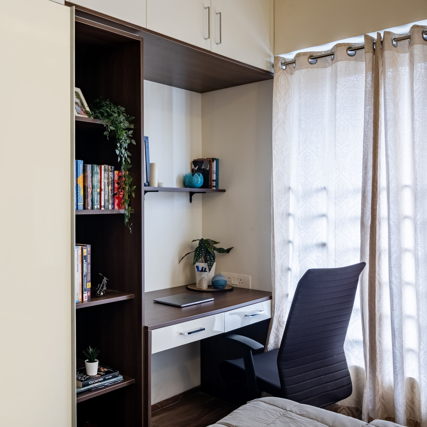 Home Office With A Tall Bookshelf - Livspace