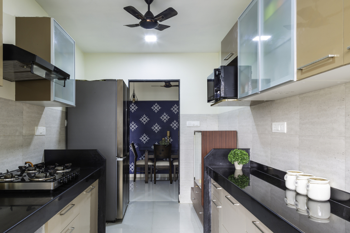 Classic Parallel Kitchen Design With Spacious Beige Storage Cabinets