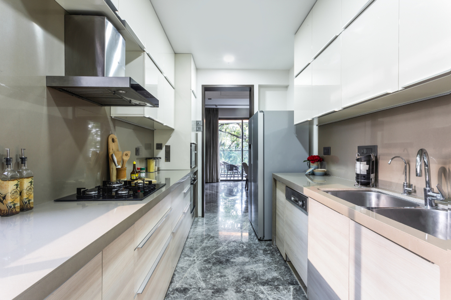 Contemporary Parallel Kitchen Design With Beige Backsplash Tiles