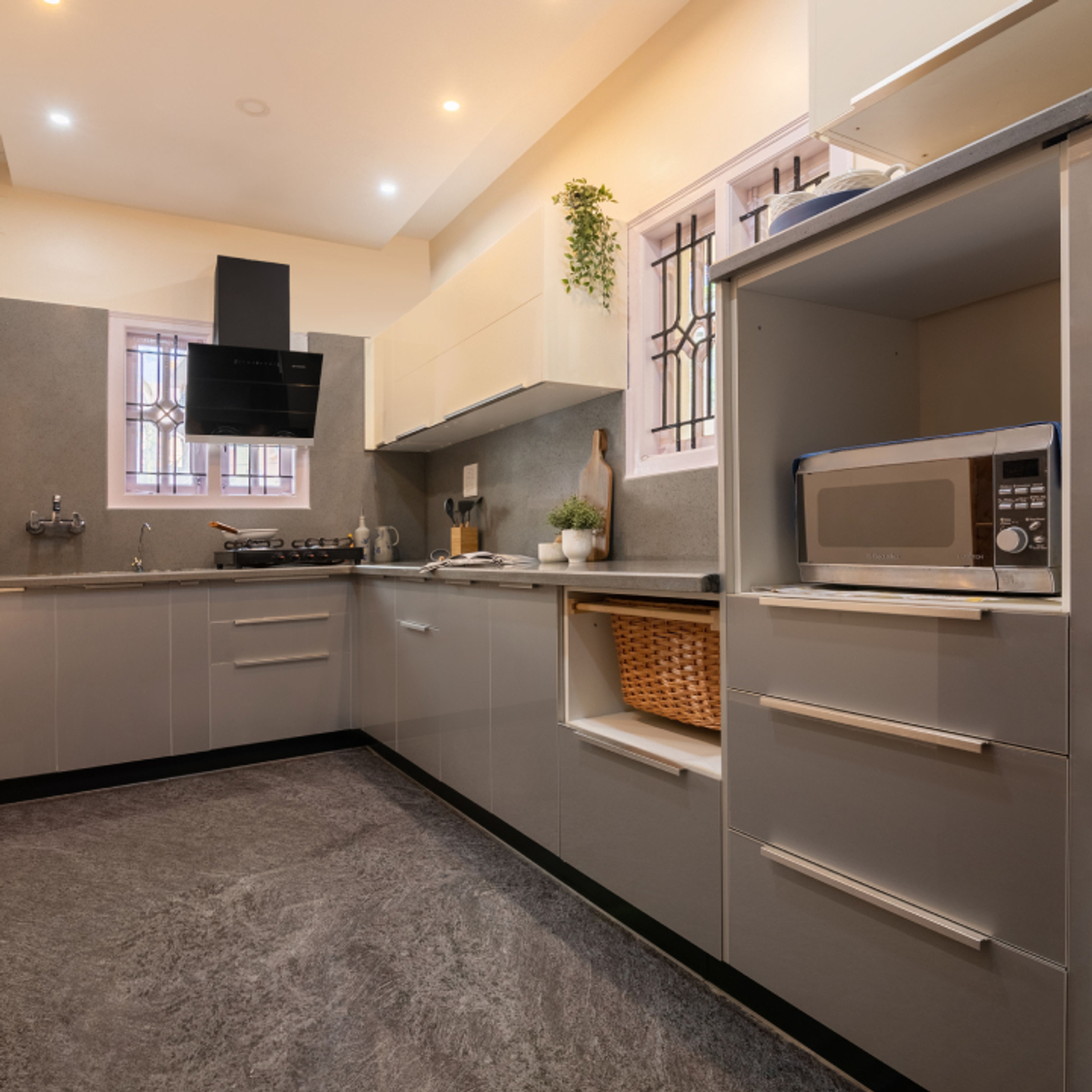 Classic L-Shaped Modular Kitchen Design With Grey Countertop And Storage Cabinets