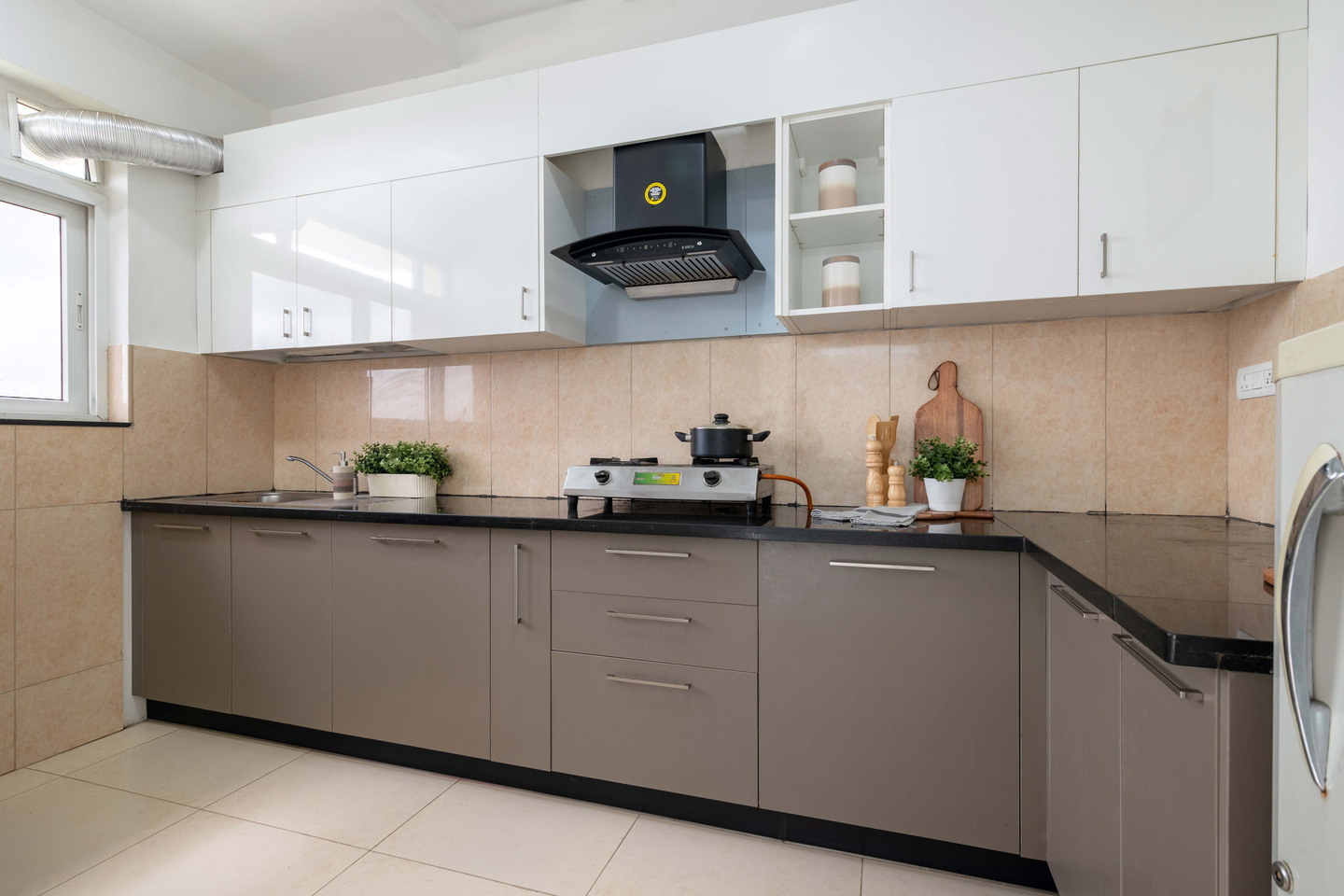 Modern Modular L-Shaped Kitchen Cabinet Design With A Black Countertop