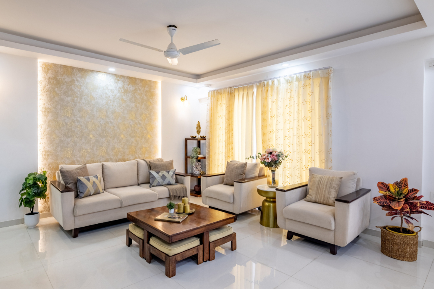 Living Room With a Light Colour Palette And 5-Seater Cream Sofas - Livspace