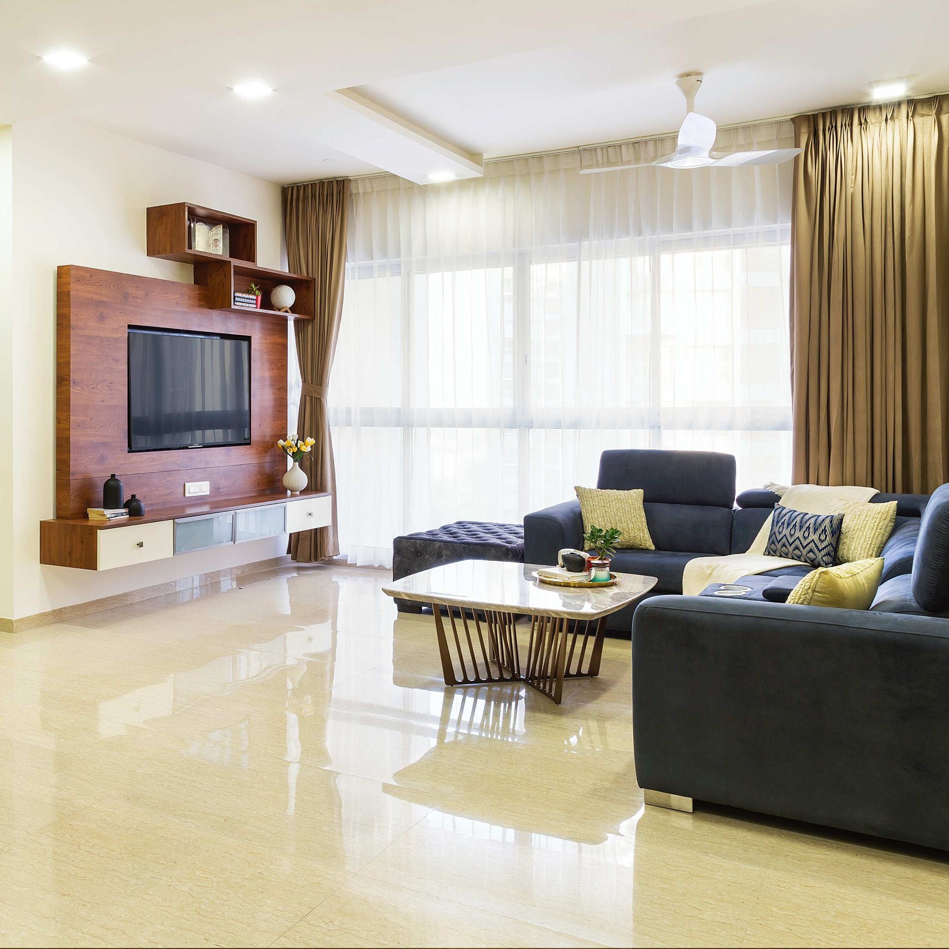 Low-Maintenance Beige Living Room Tile Design | Livspace