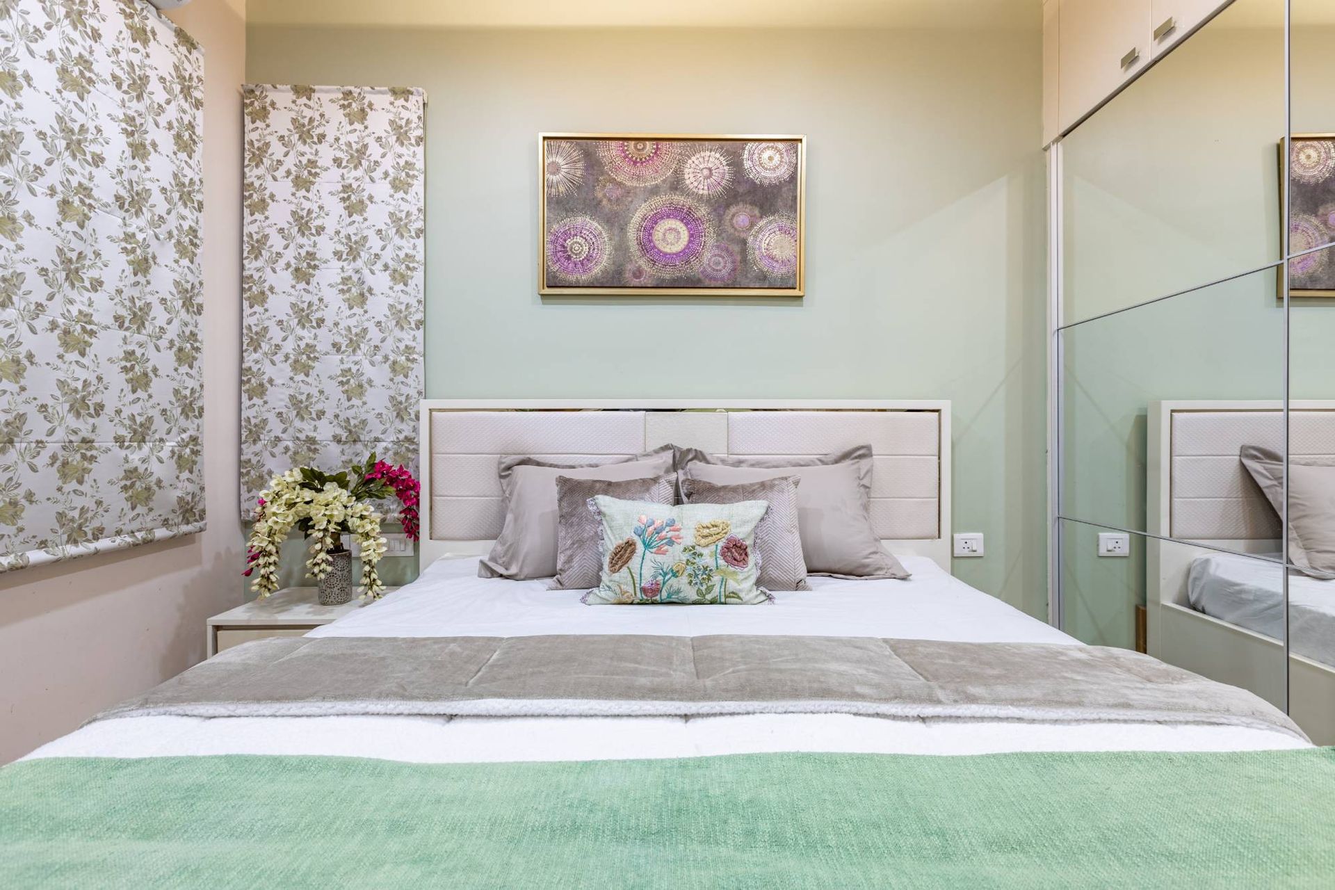 Compact Guest Bedroom Design With Pastel Green Interiors | Livspace