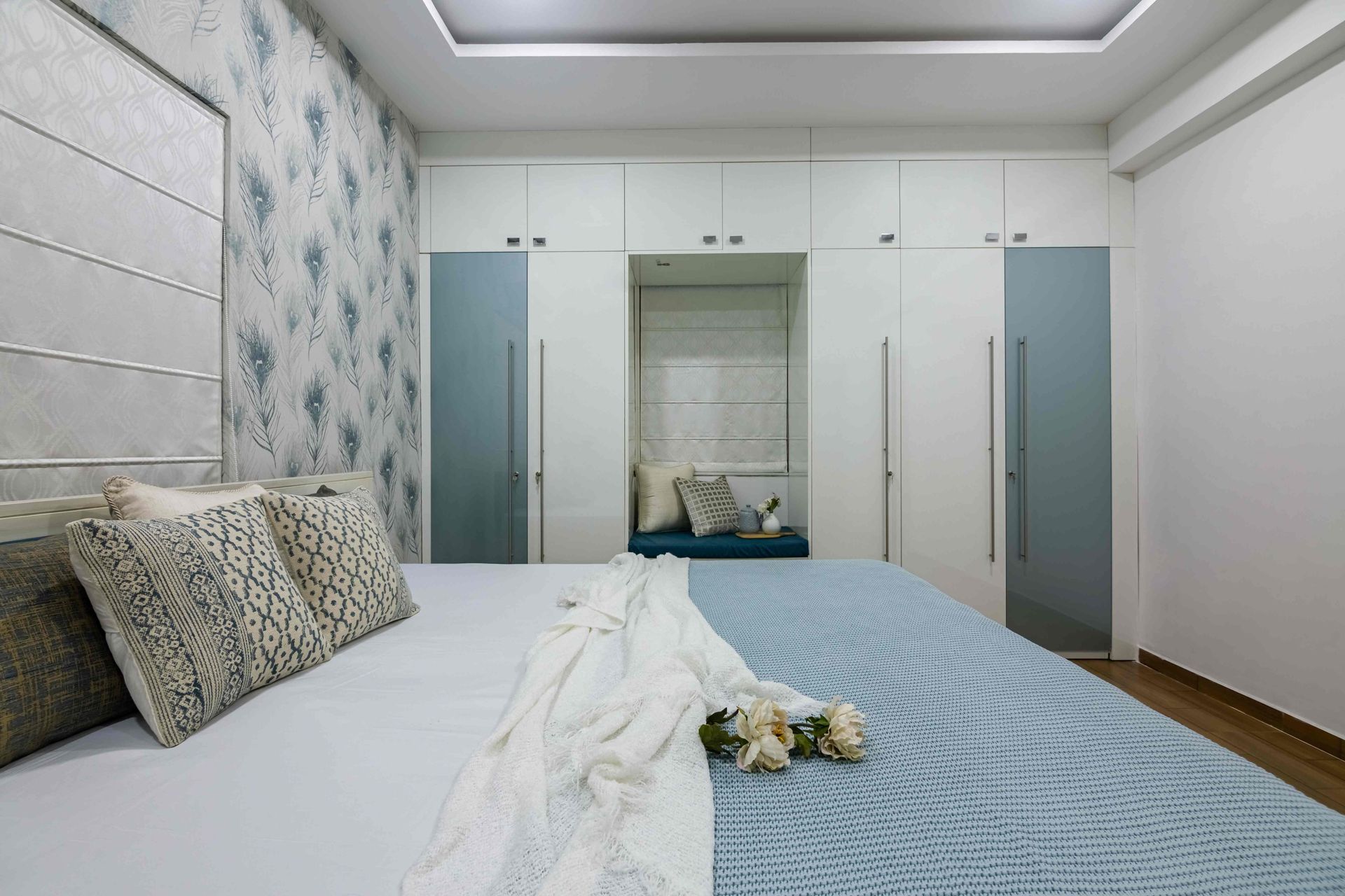 Master Bedroom Design With A White And Blue Motif Wallpaper | Livspace