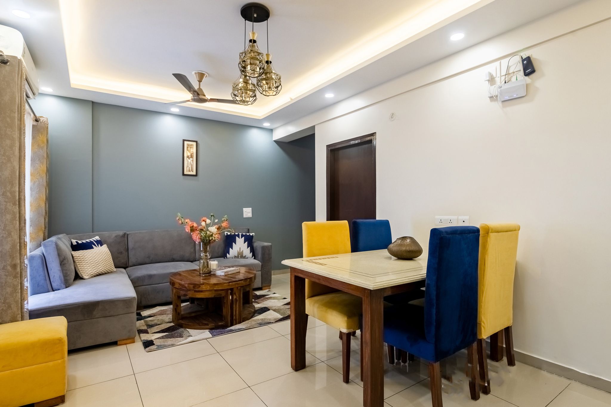 Spacious Blue And Yellow Dining Room Design | Livspace