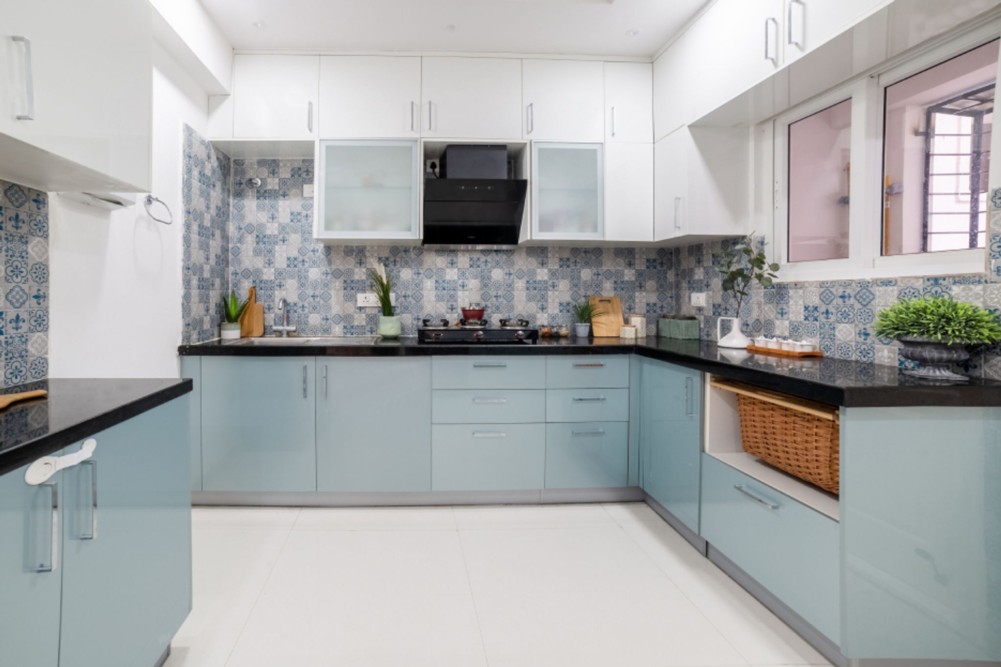 Modular Kitchen Design With Blue And White Patterned Dado Tiles | Livspace