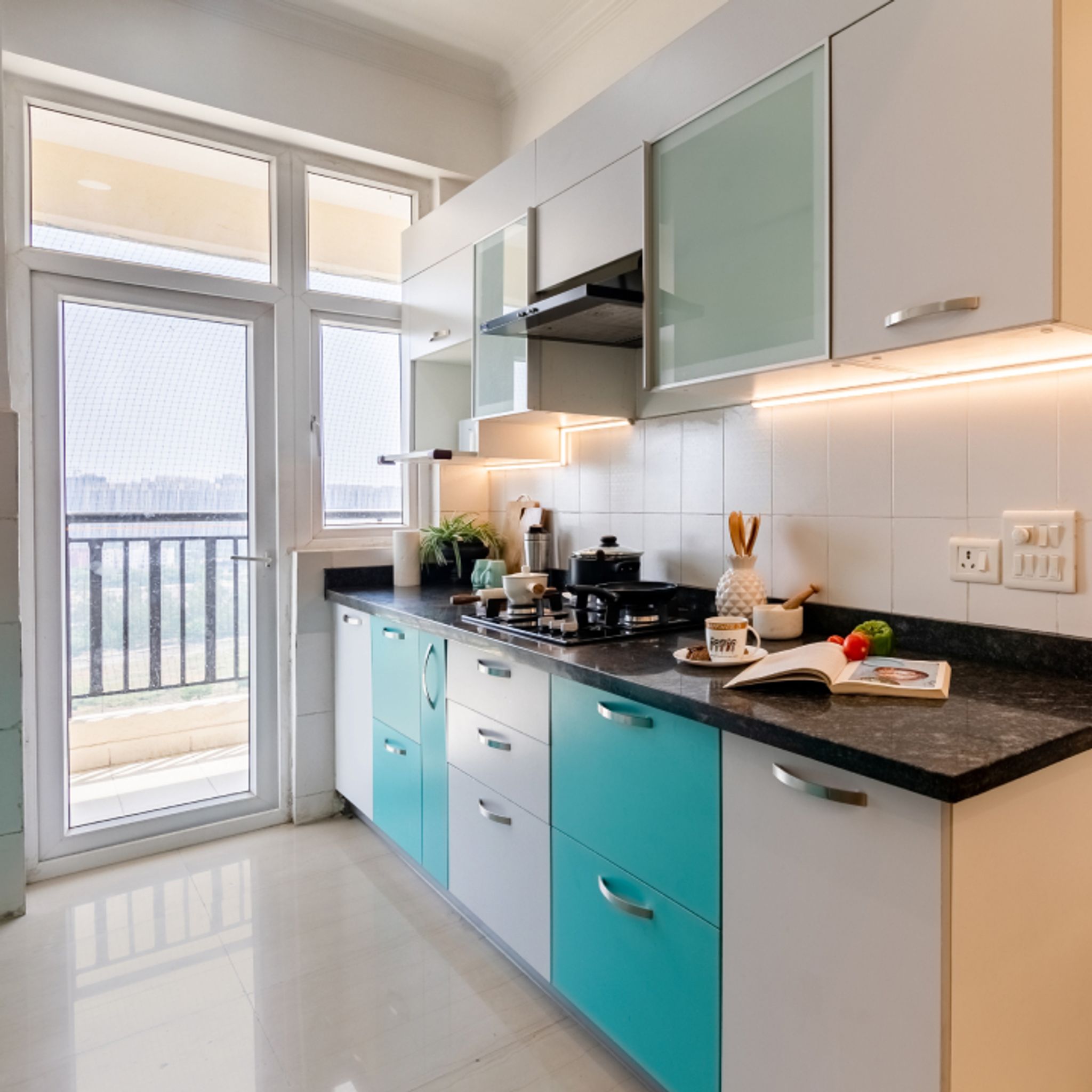 Compact Kitchen Design with Blue And White Storage Units | Livspace