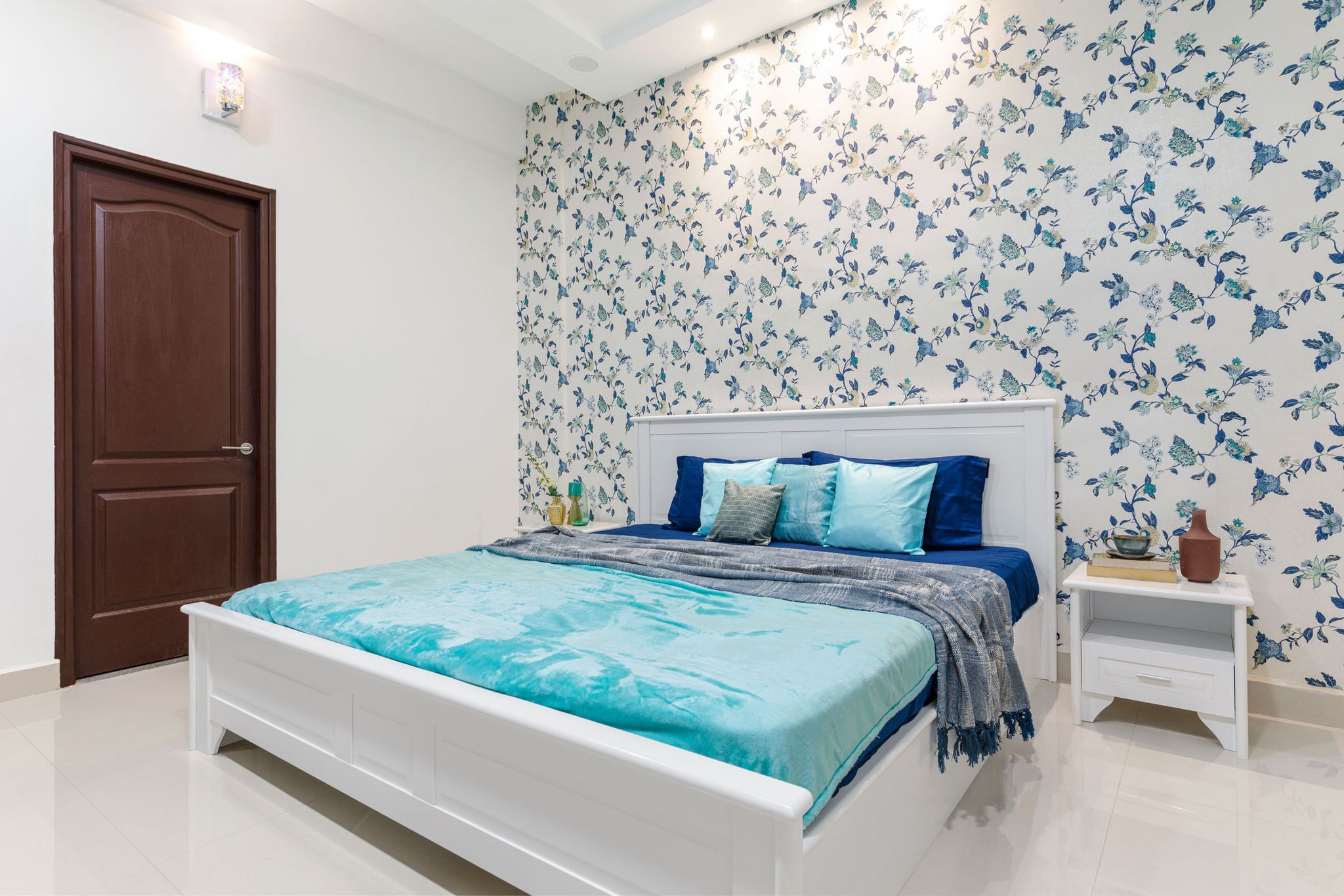 Spacious Guest Bedroom Design With Floral Blue Wallpaper And Brown ...