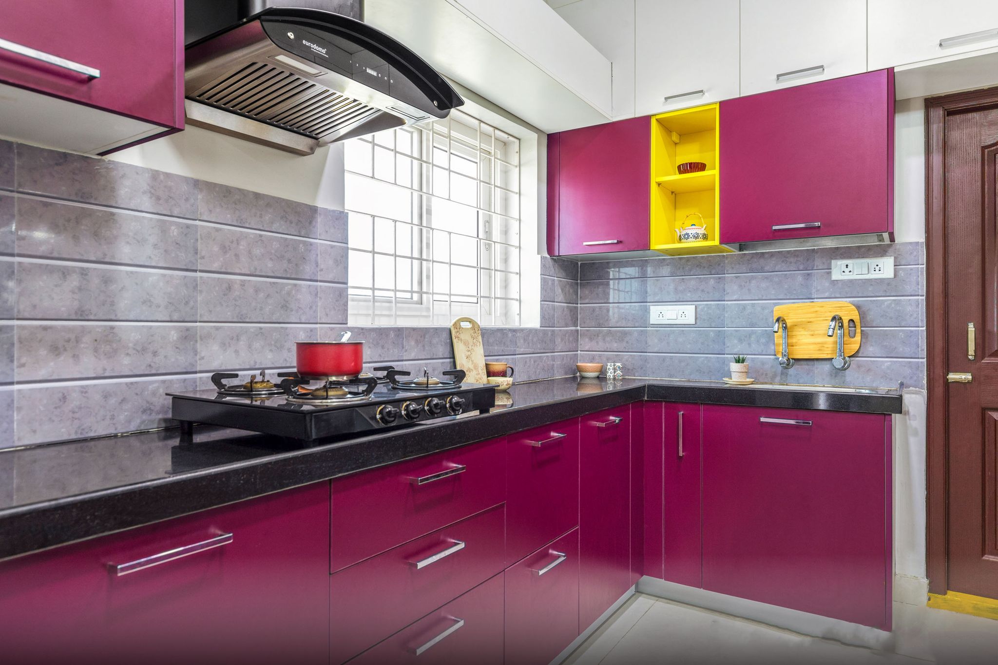 L-Shaped Aubergine-Toned Kitchen Design With Yellow Open Storage And ...