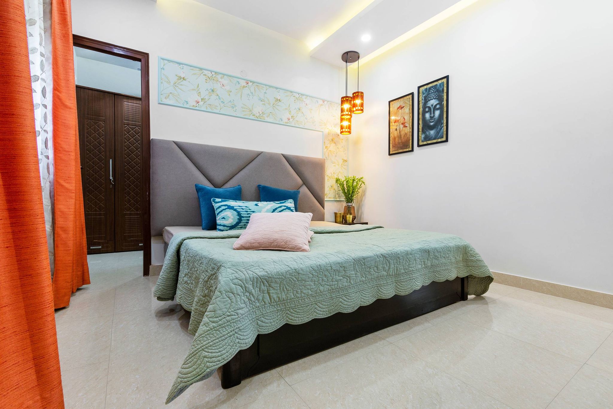 Compact Guest Room Design With Grey Headboard And Wall Art | Livspace