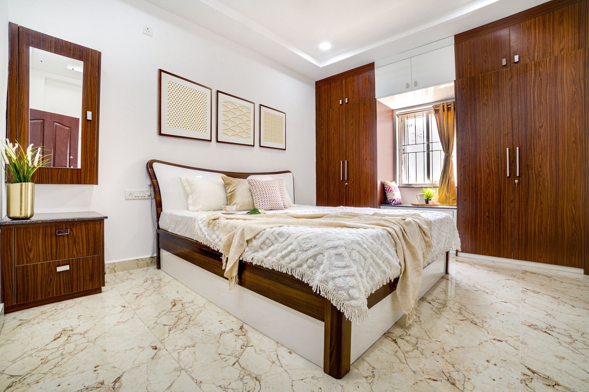 Master Bedroom Design With White Walls And Framed Art | Livspace