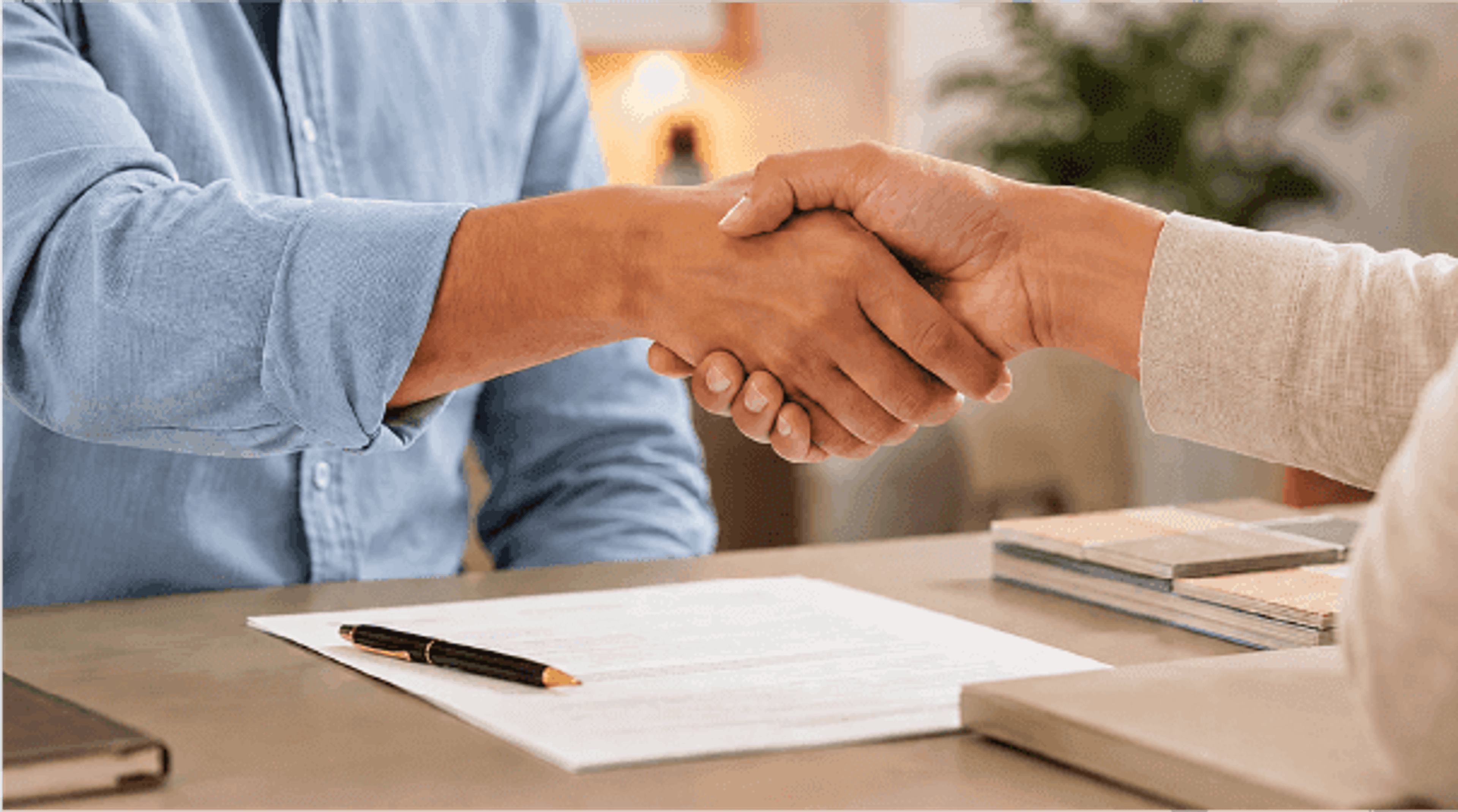 A handshake closing a deal