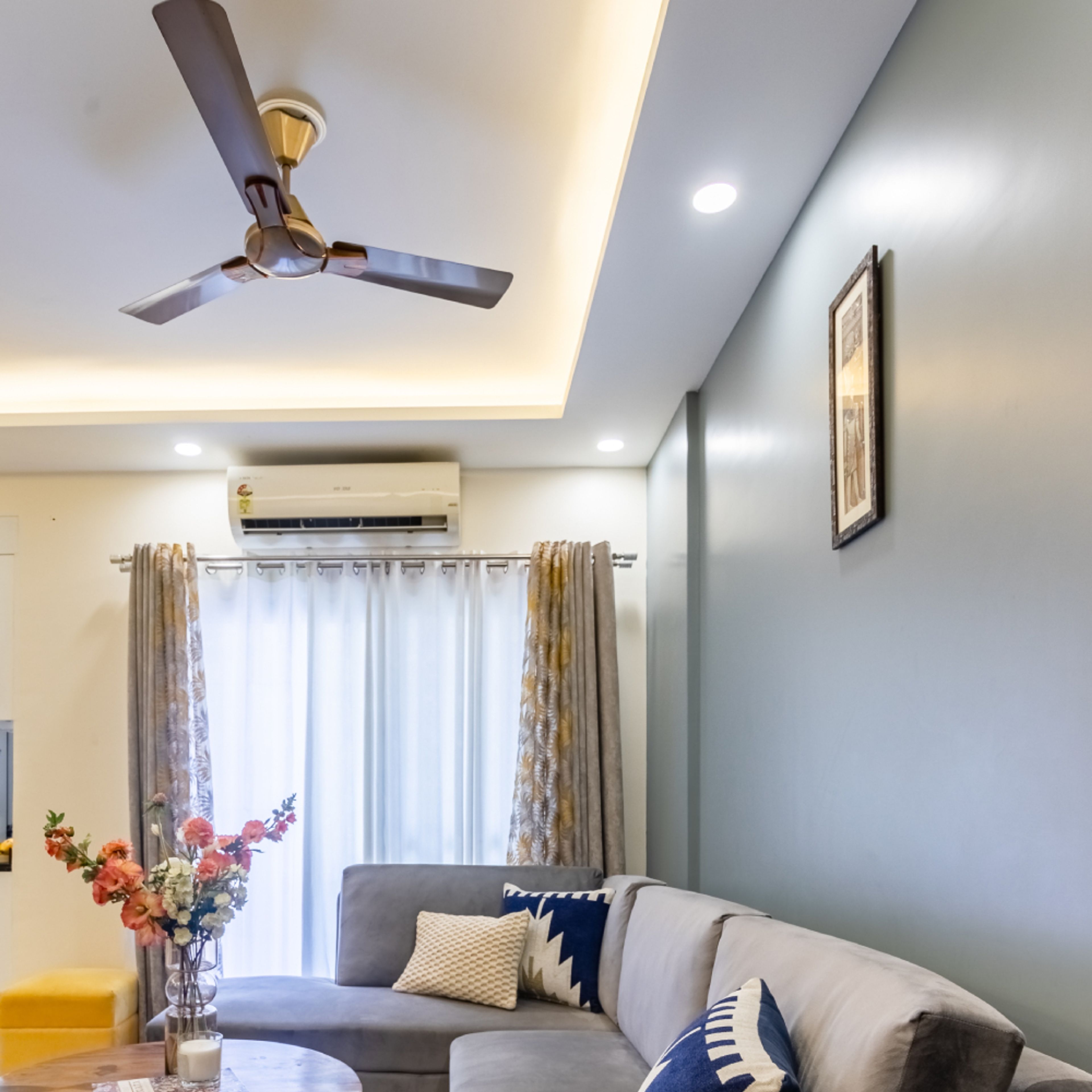 Elegant False Ceiling Design With Grey Couch