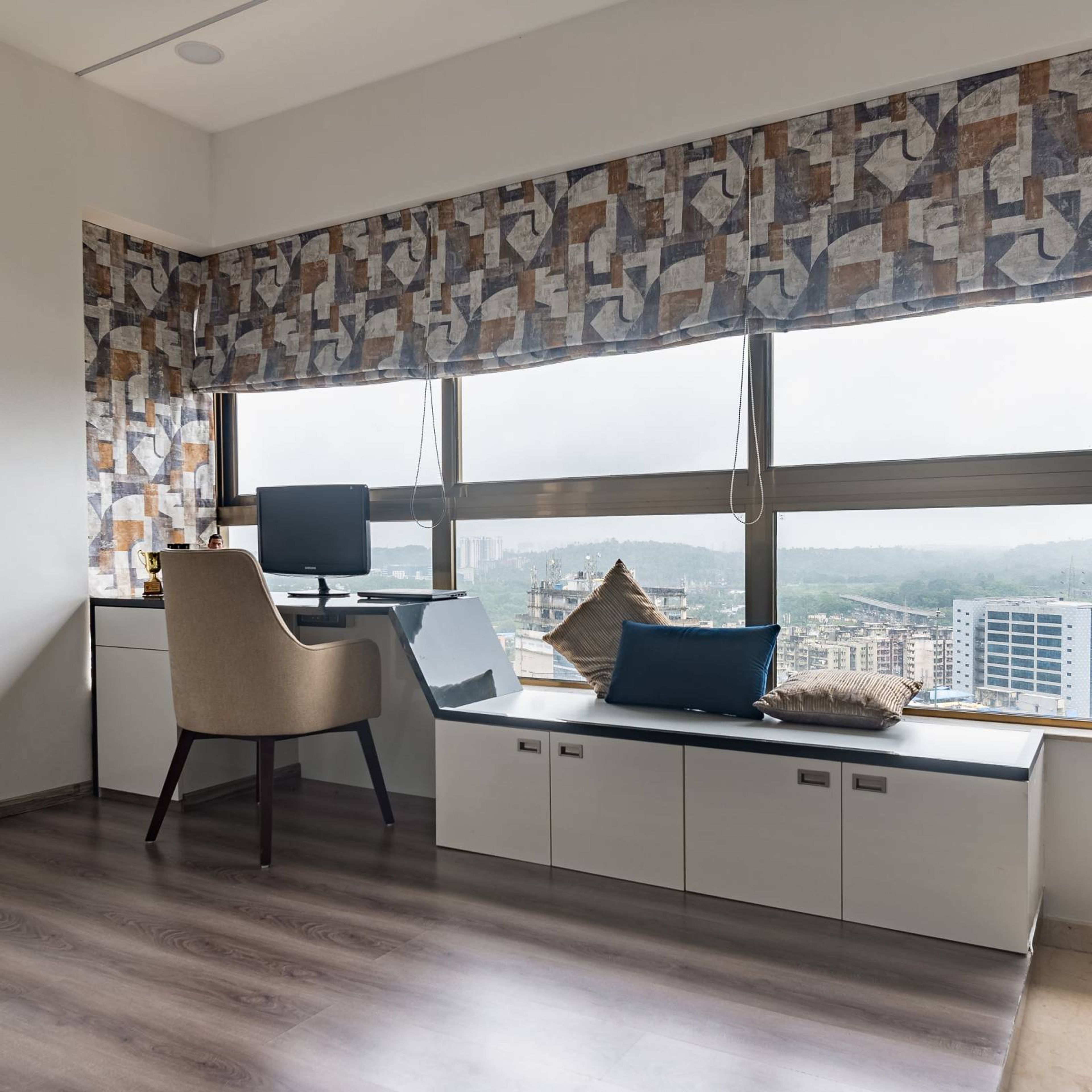 Modern White And Grey Home Office Design With Window Seater Storage