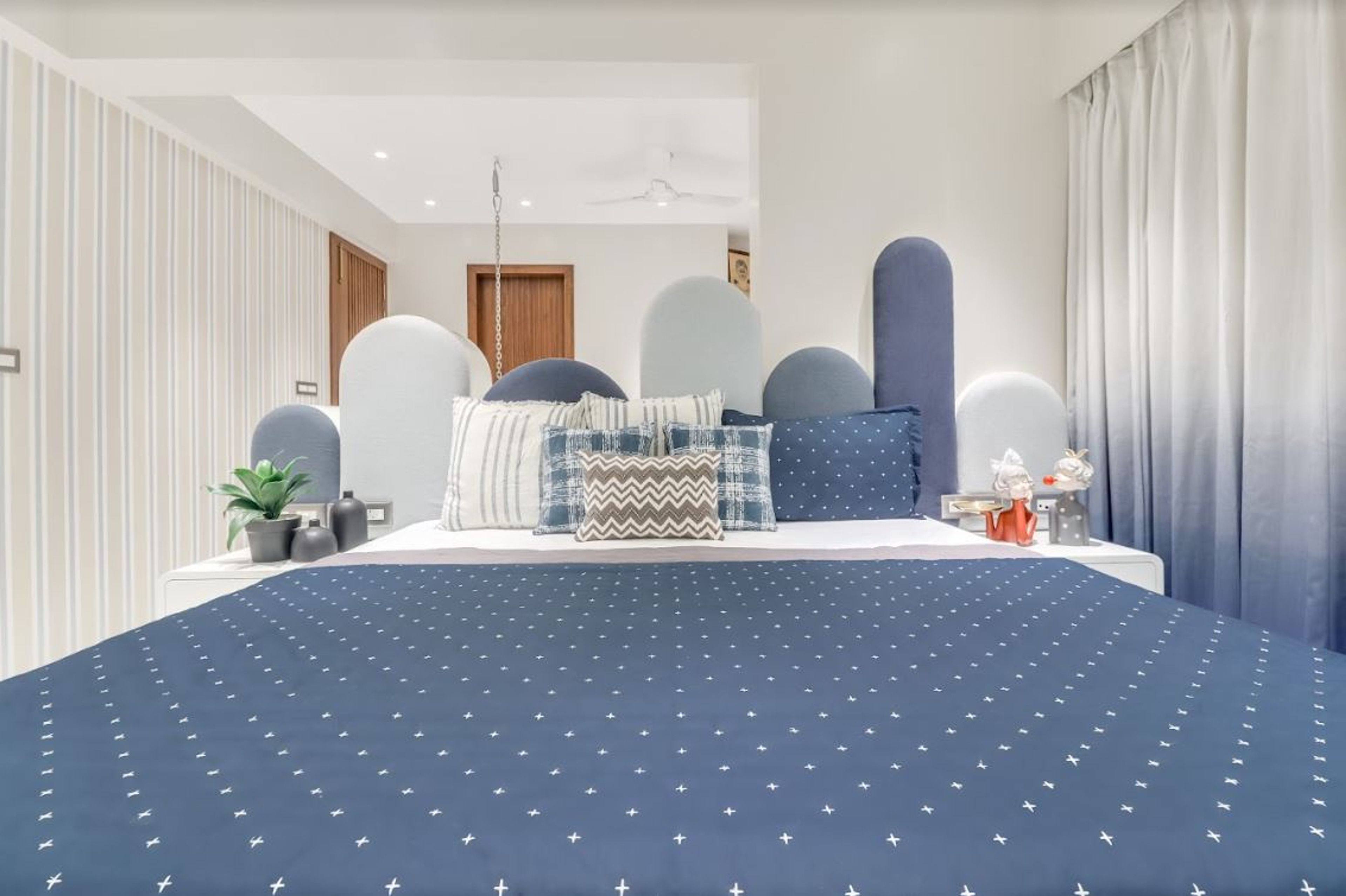 Contemporary Boys Room Design With Arched Blue And White Tufted Headboard