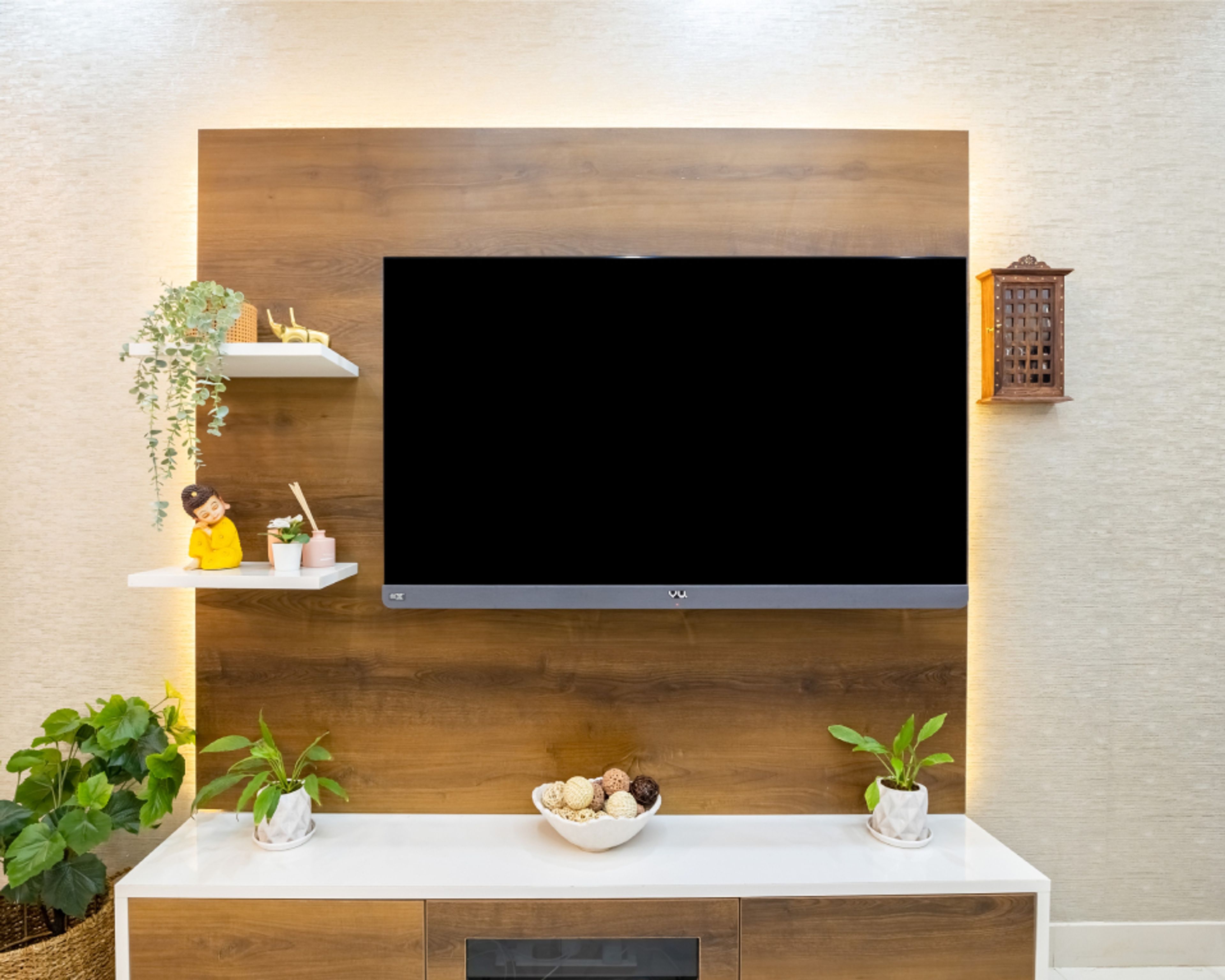 Light-Coloured Living Room Wallpaper With A Compact TV Unit - Livspace