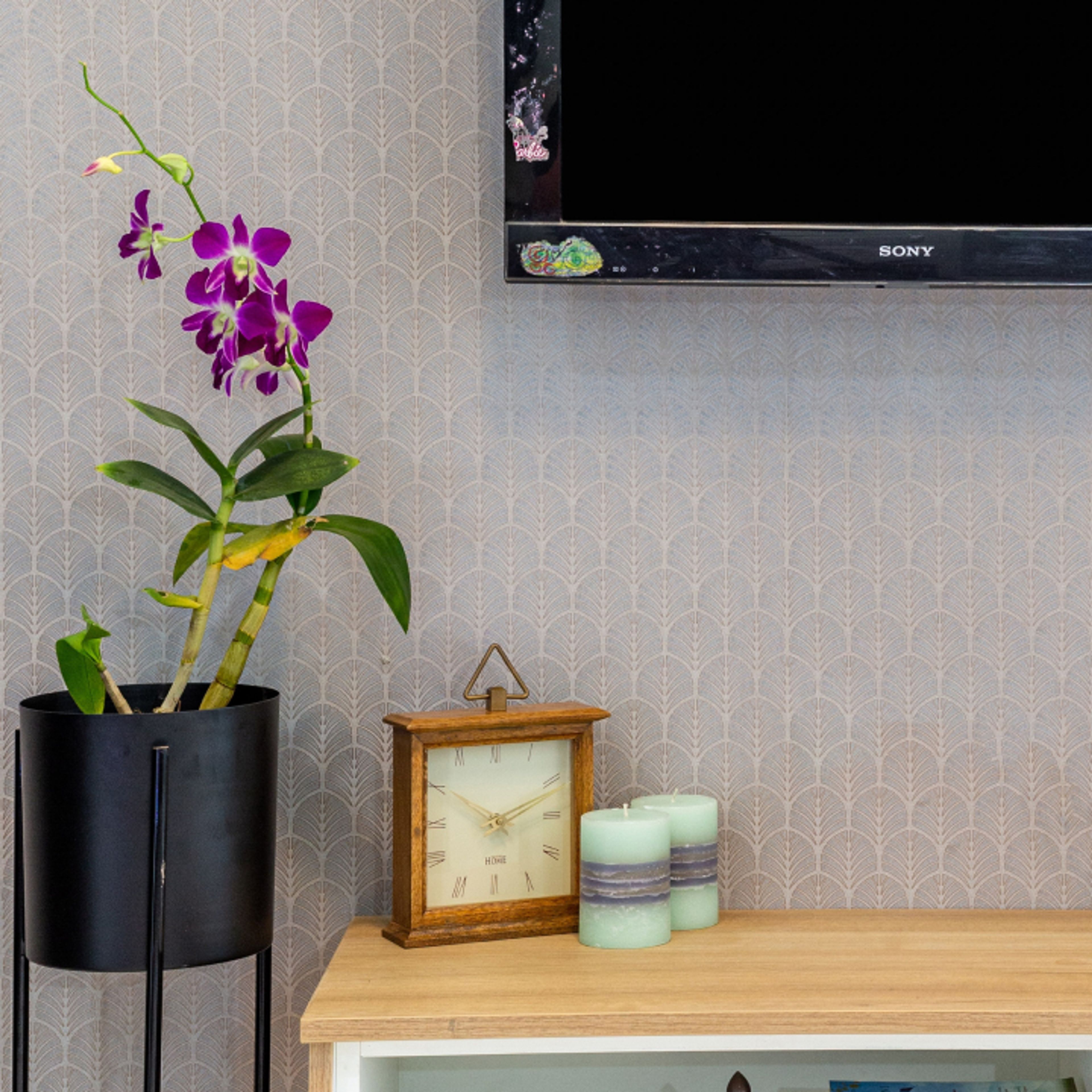 Grey Living Room Wallpaper With A TV Wall And CNC Partition - Livspace