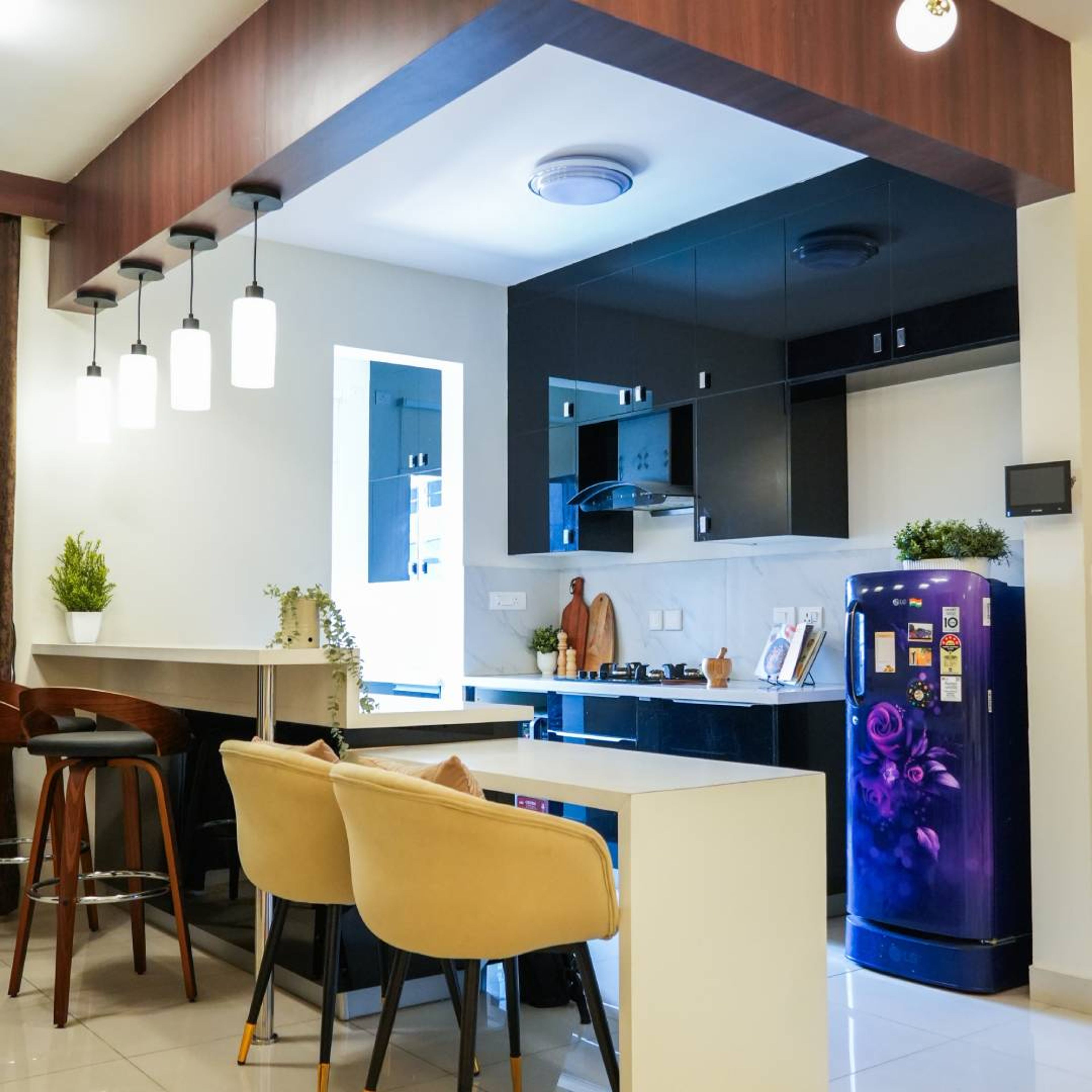 Open Kitchen Design with Two Yellow Chair and White Island