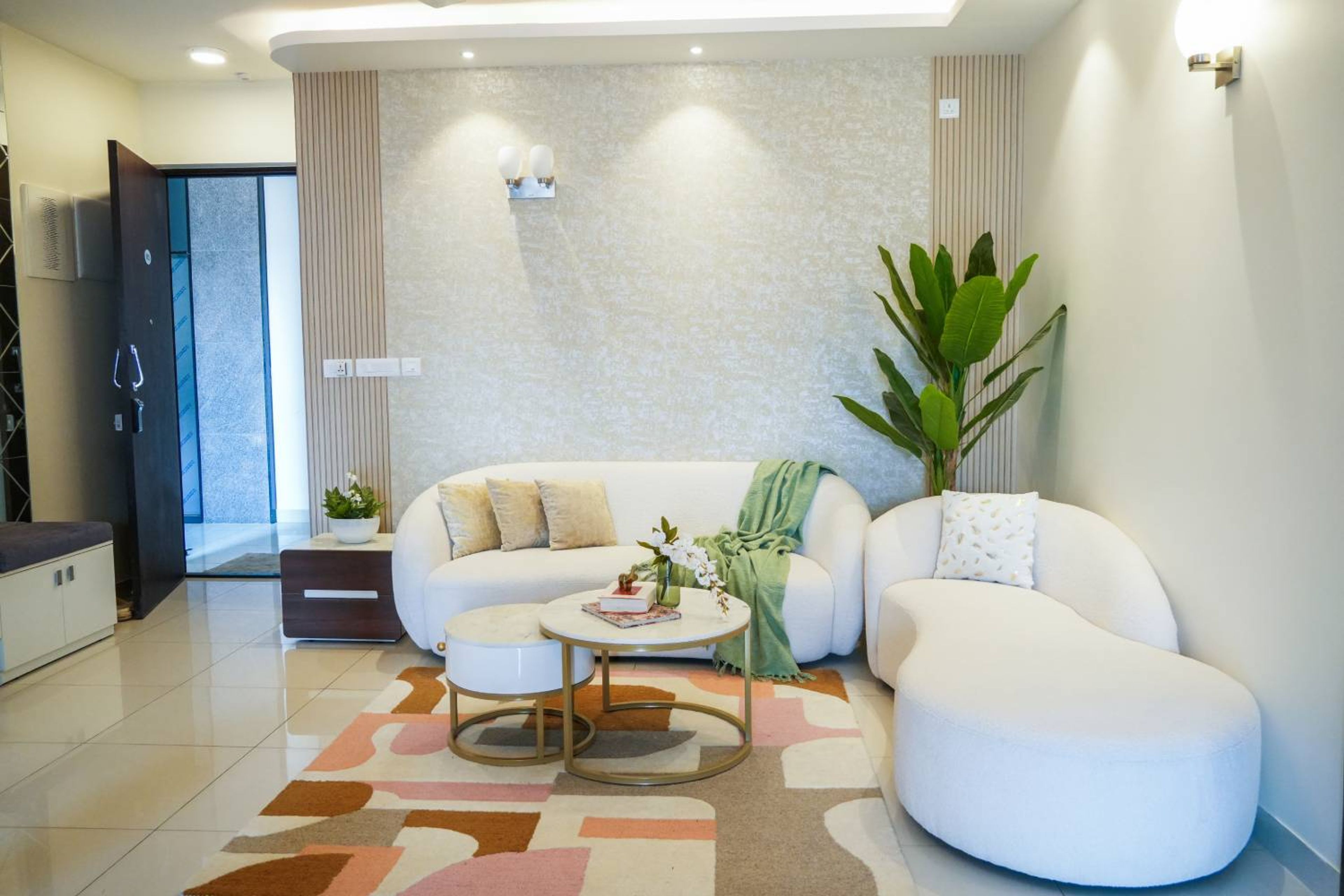 Living Room Design with Two White Oval Shaped Sofas