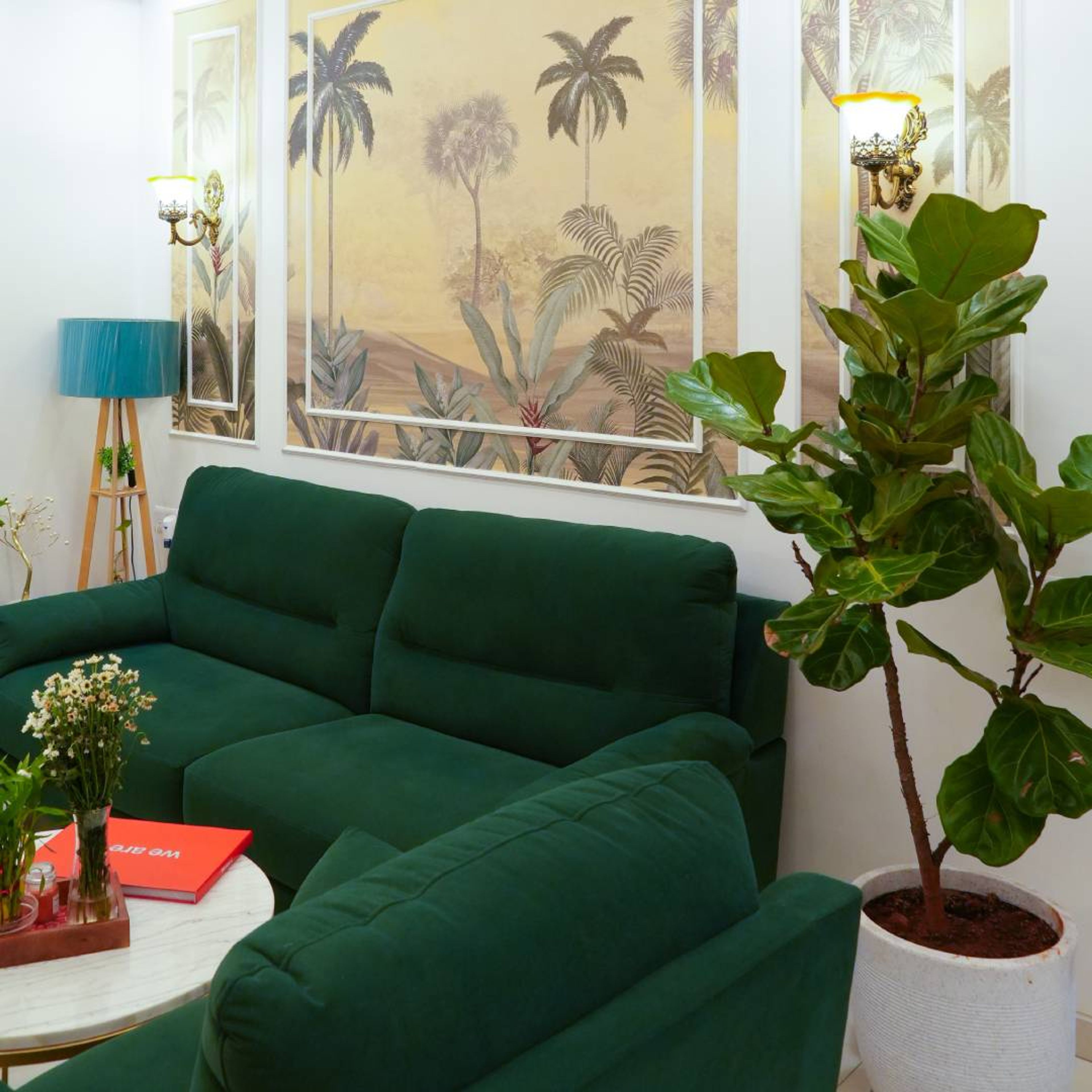 Living Room Design with Dark Green Sofa and Tropical Wallpaper