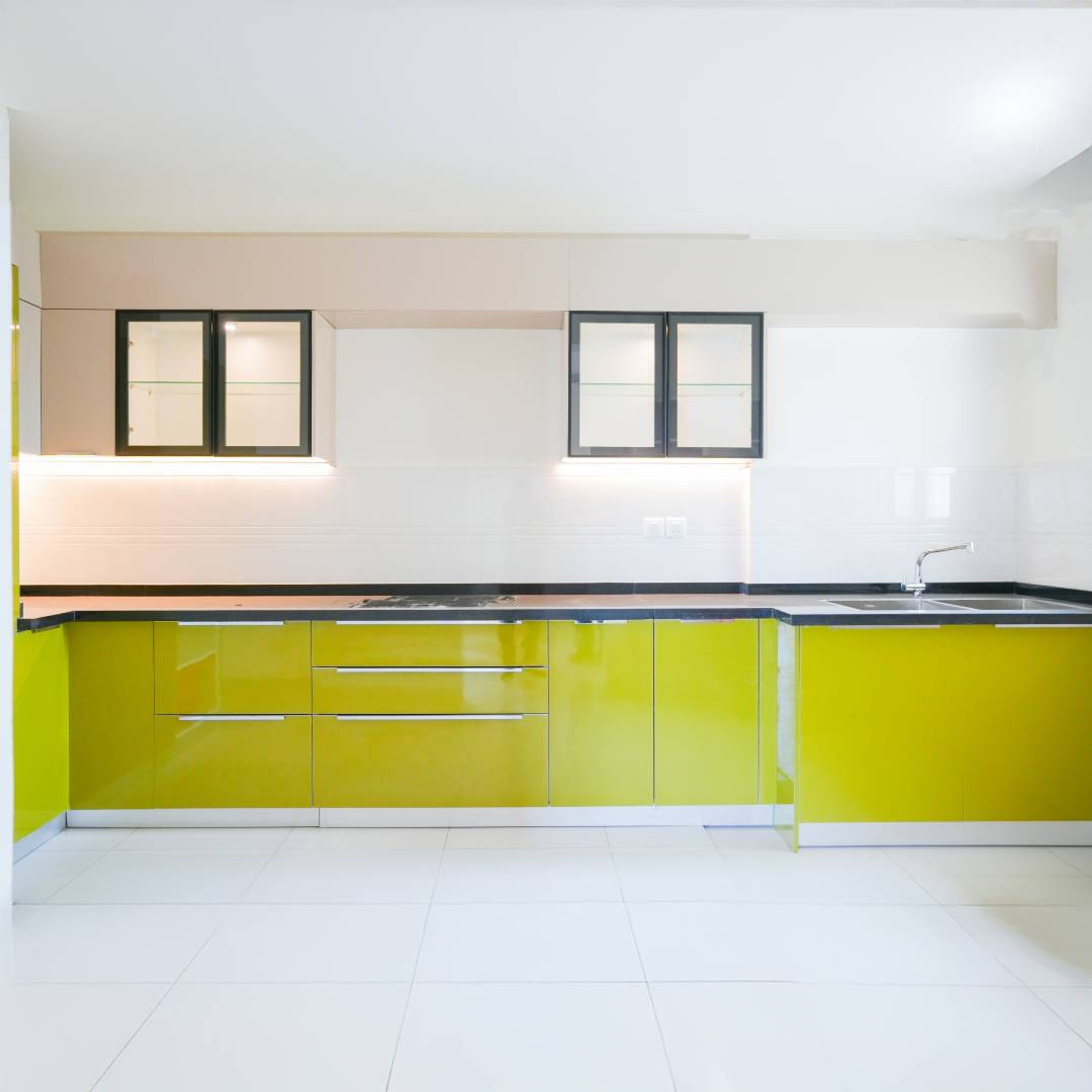 L-Shaped Kitchen Design with Yellow Base Cabinets and White Backsplash