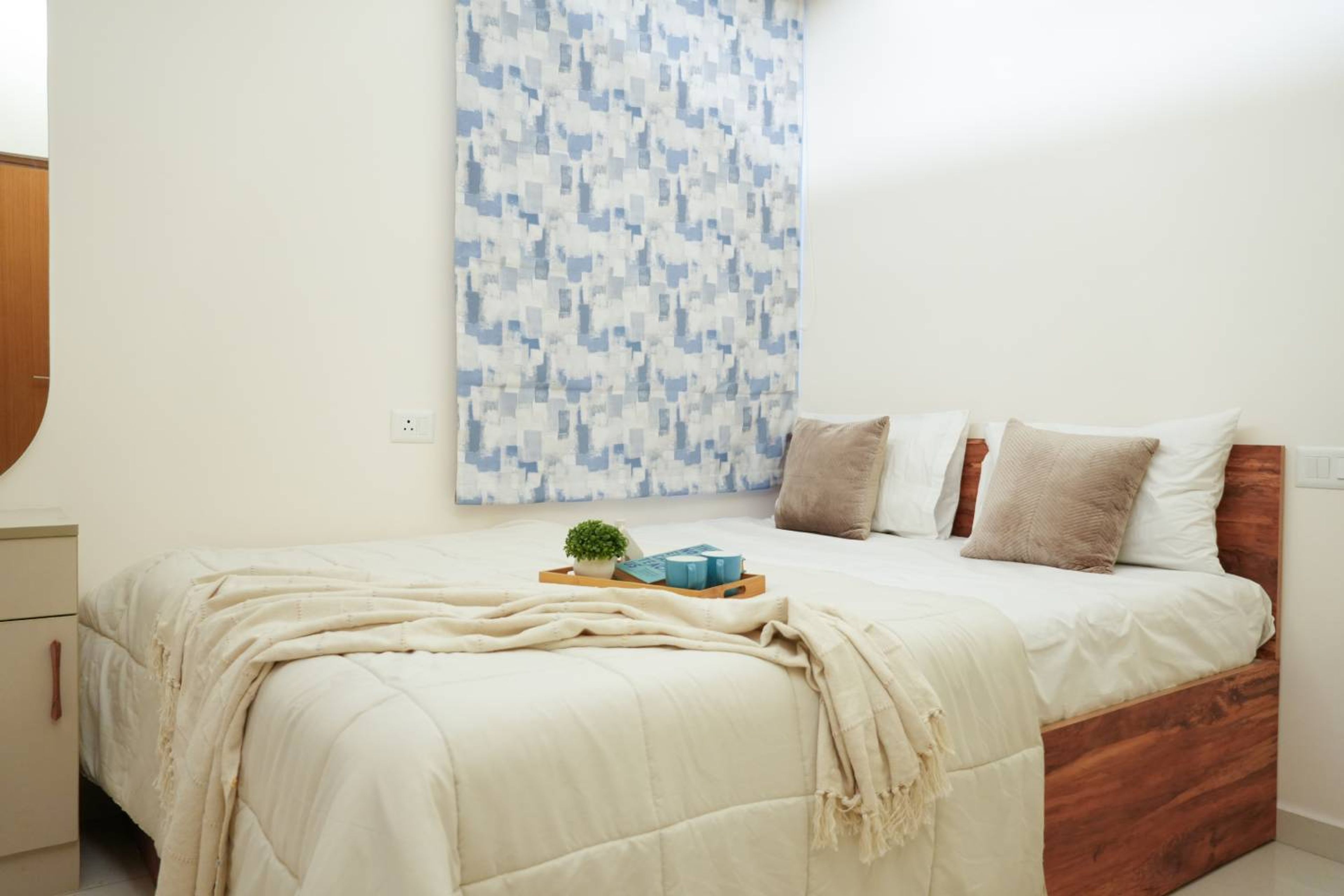 Guest Bedroom Design with Wooden Headboard Bed and White Walls