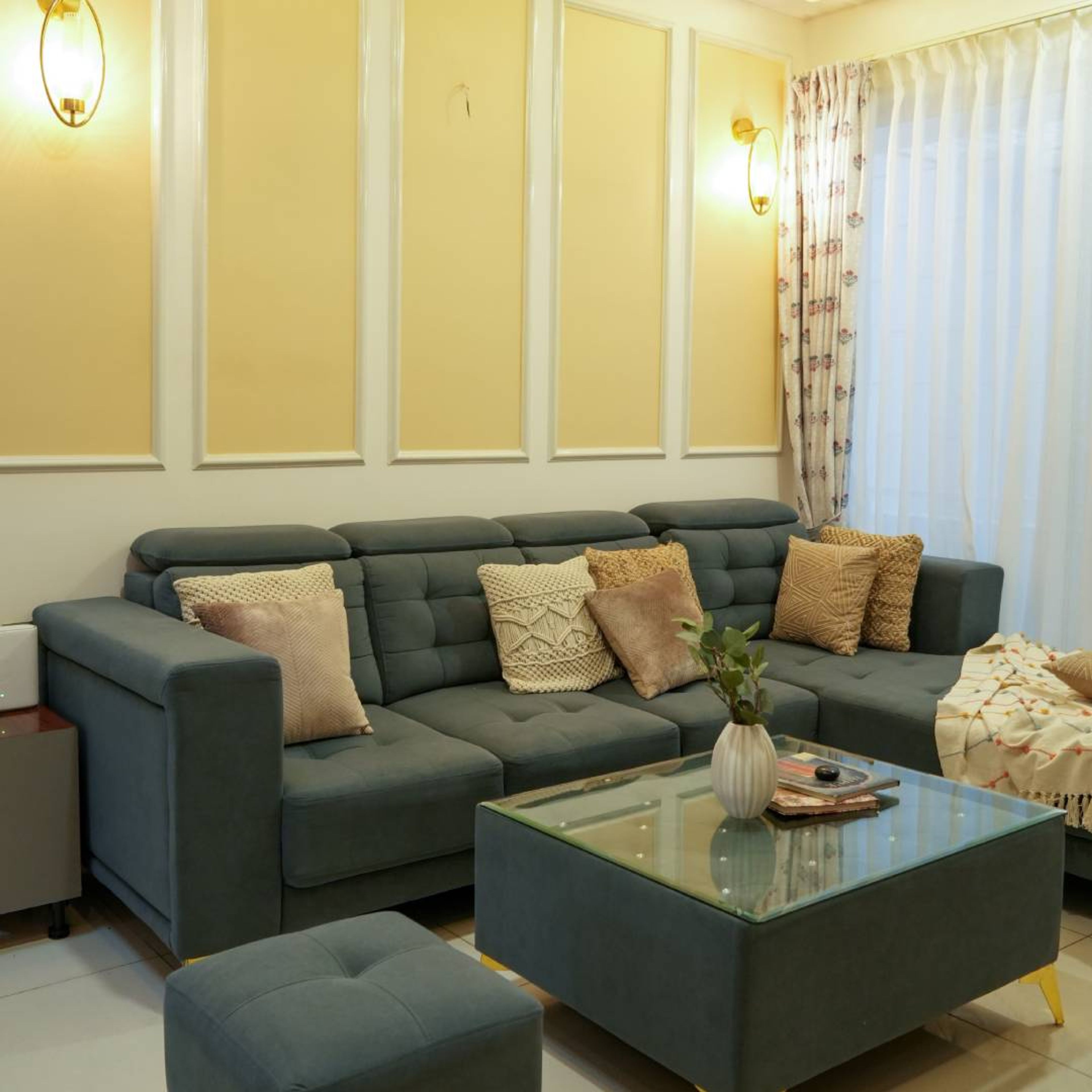 Living Room Design with Grey L-Shaped Sofa and Cream Wall and Yellow Panels
