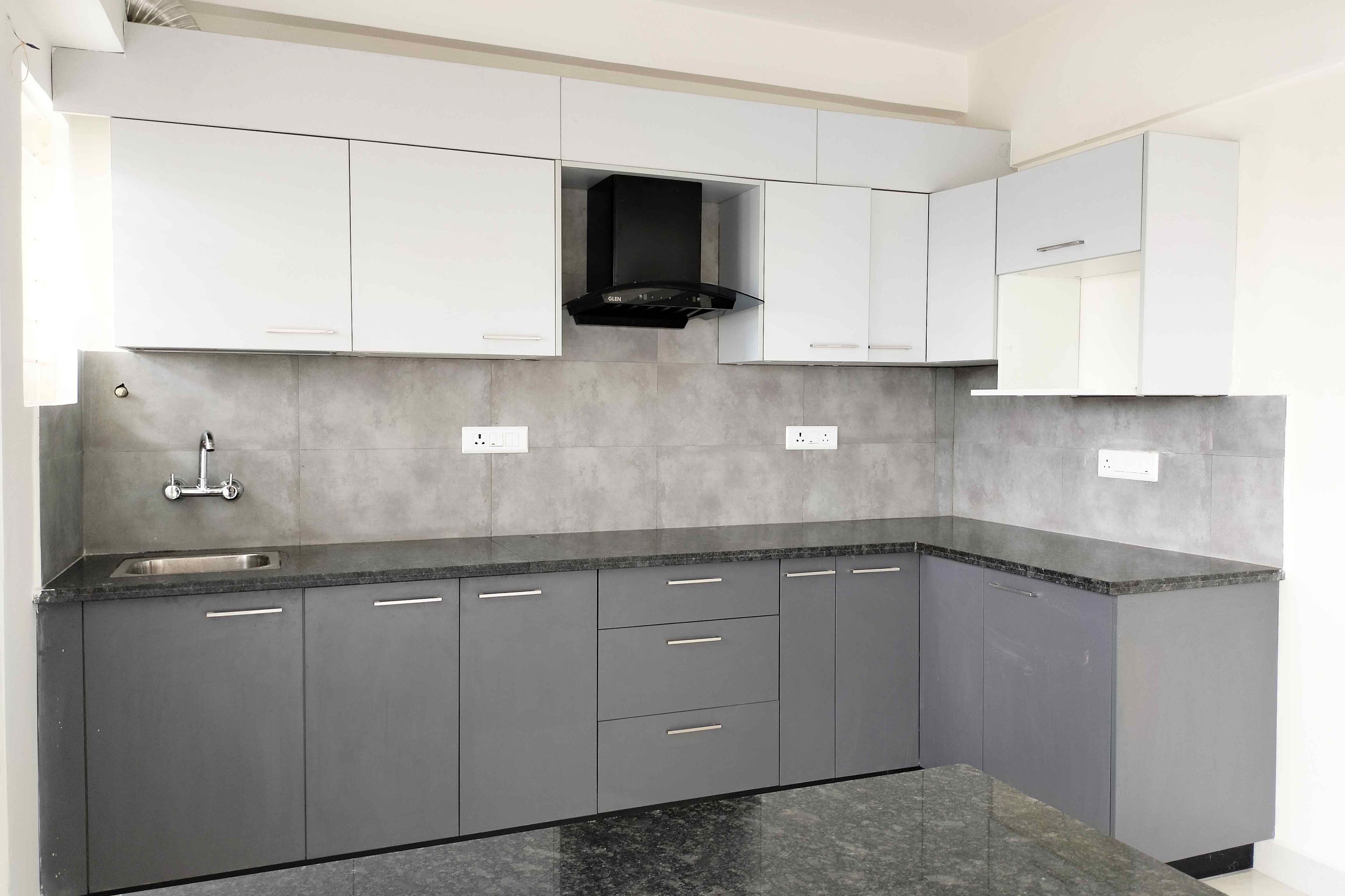 L-Shaped Kitchen Design with Grey and White Units and Granite Countertop