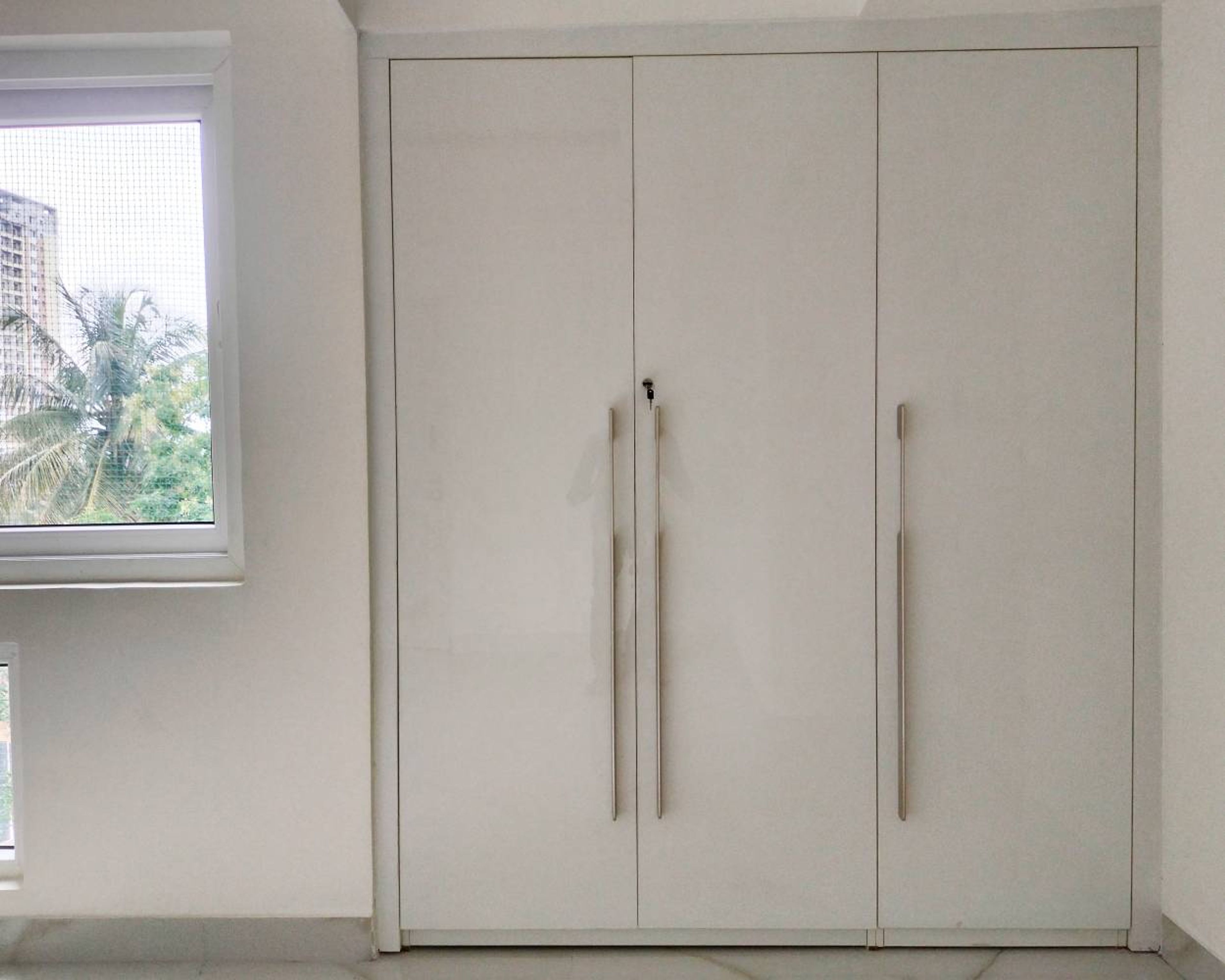 3-Door White Swing Wardrobe Design