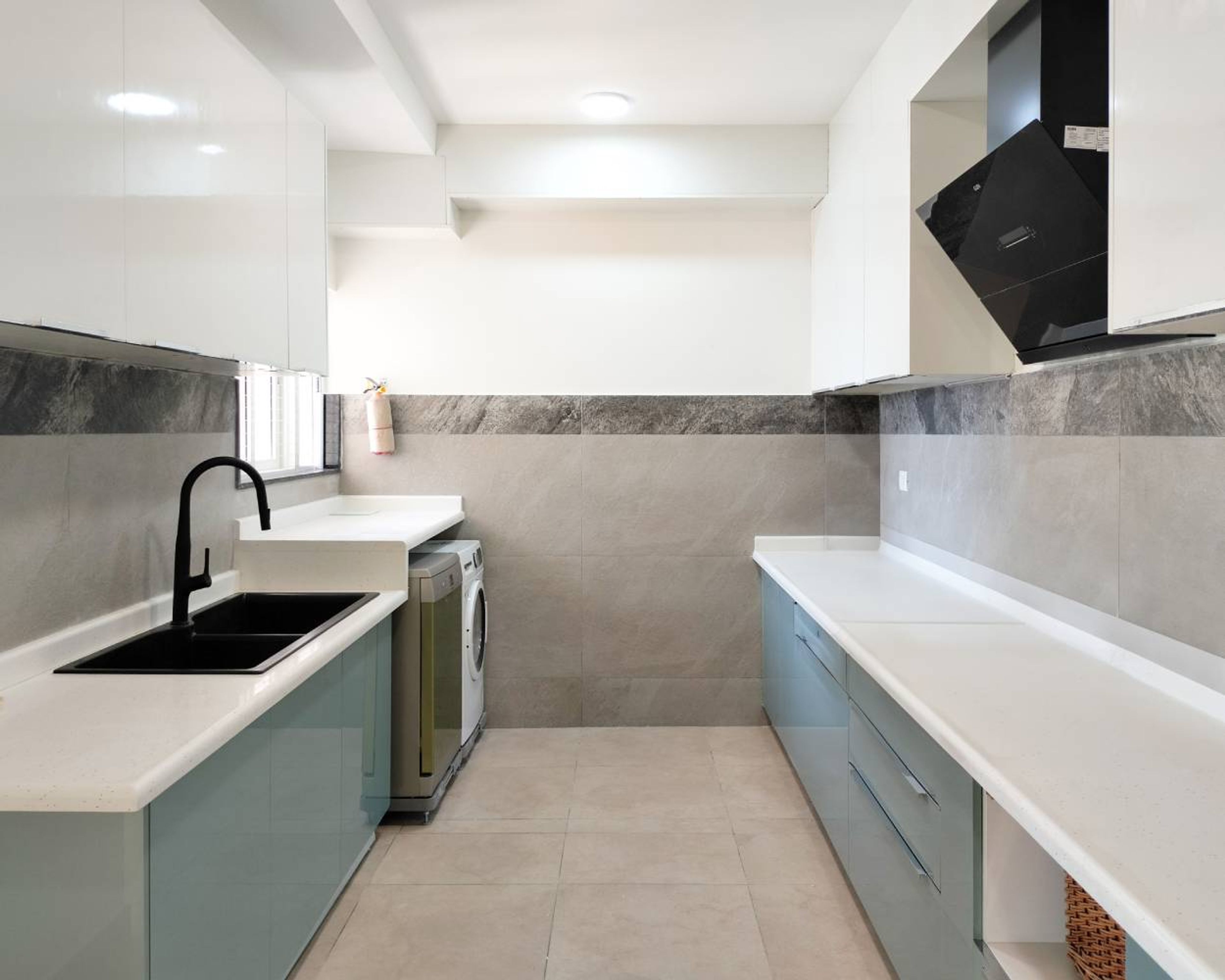 Parallel Kitchen Deign with Blue Base Units and White Wall Units