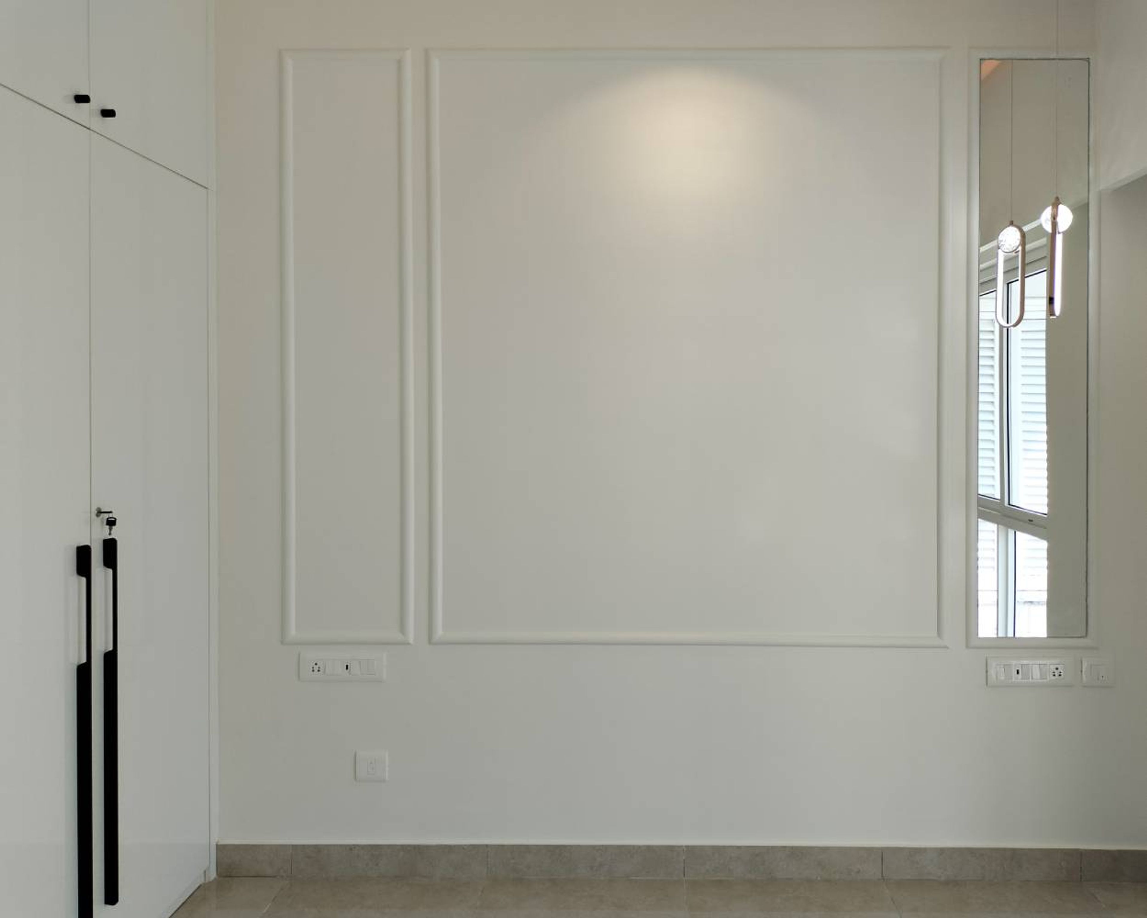 Bedroom Design with White Walls with Trims and Wall Mounted Mirror