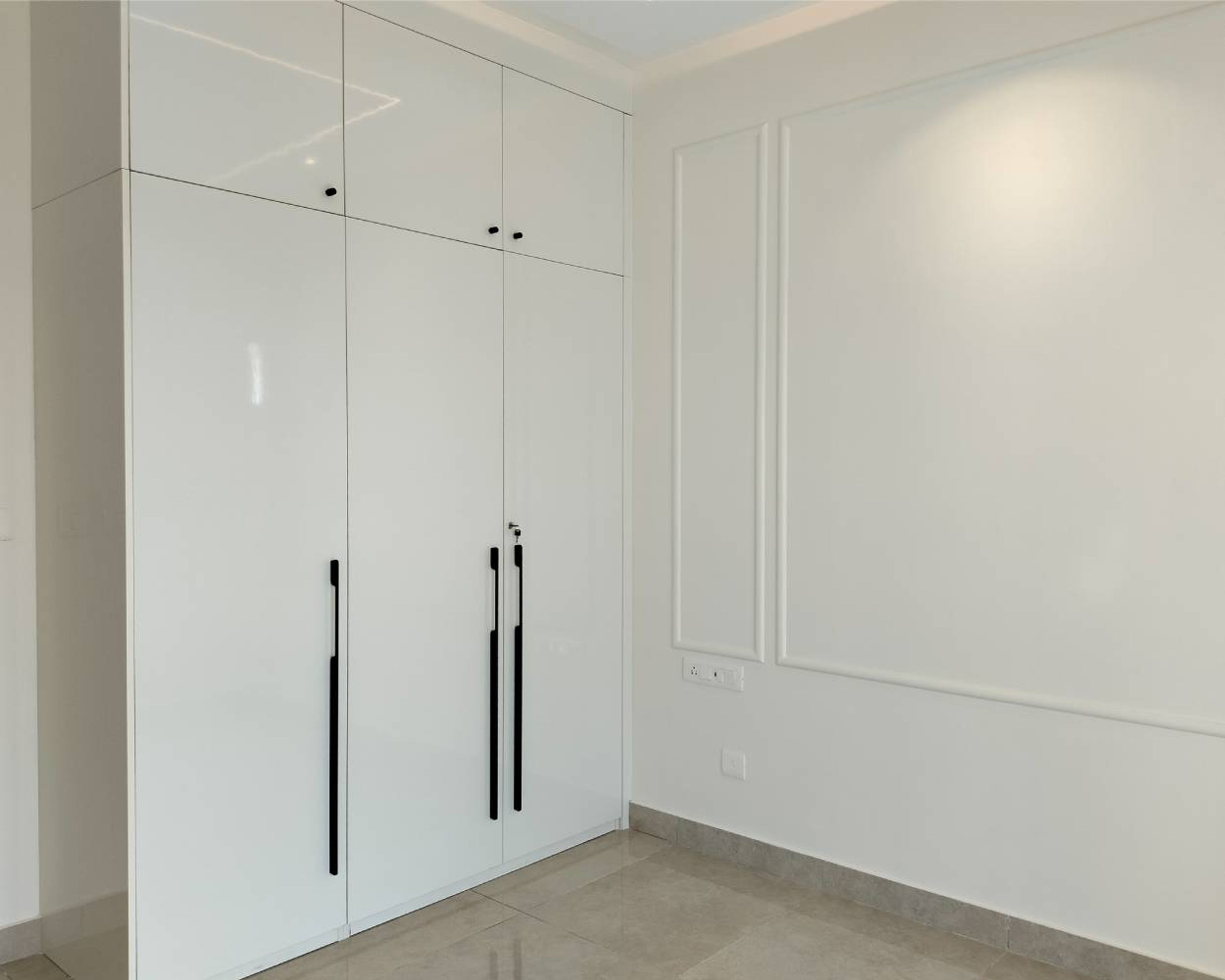 3-Door White Swing Wardrobe Design with Loft Unit