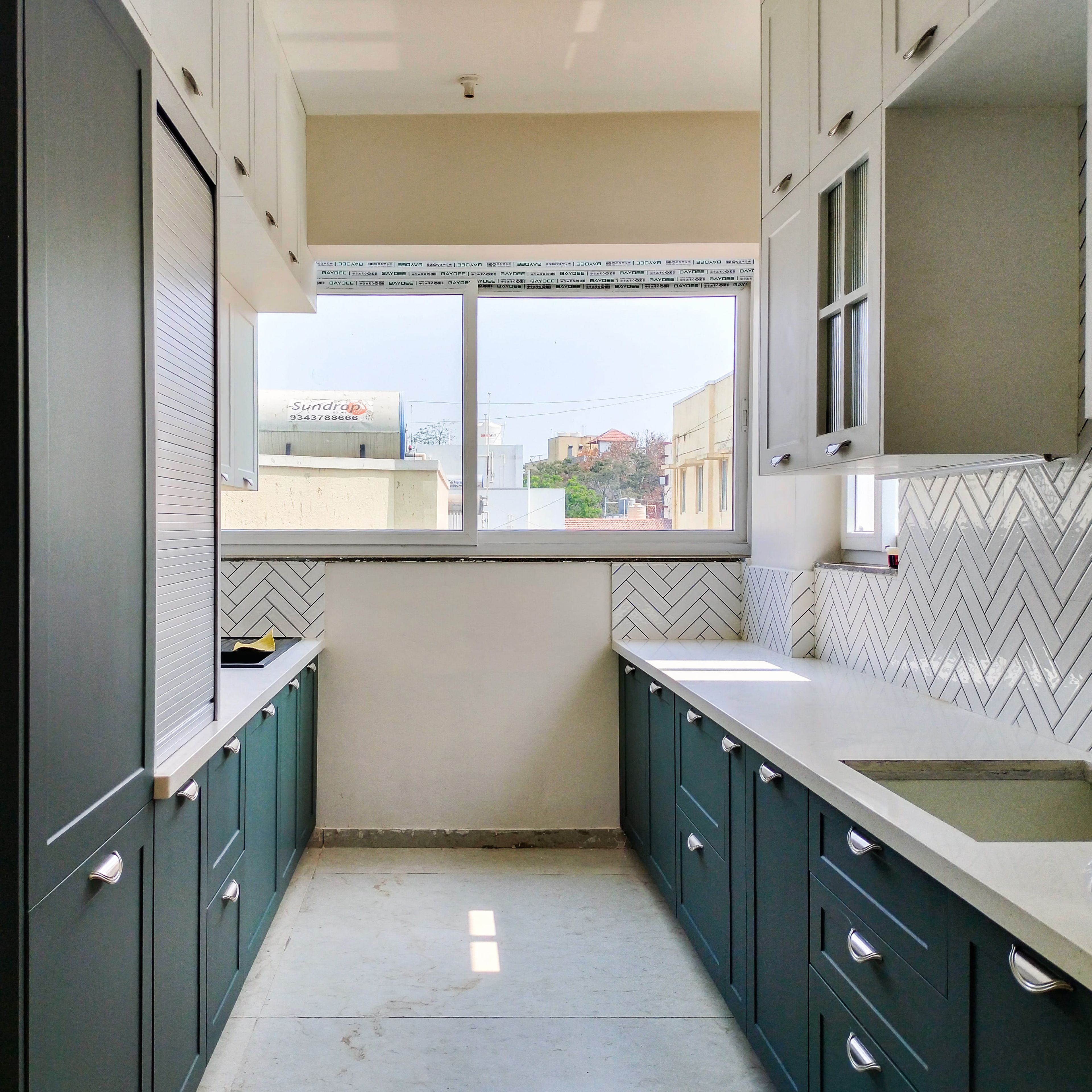 Parallel Kitchen Design with Dark Green and White Units