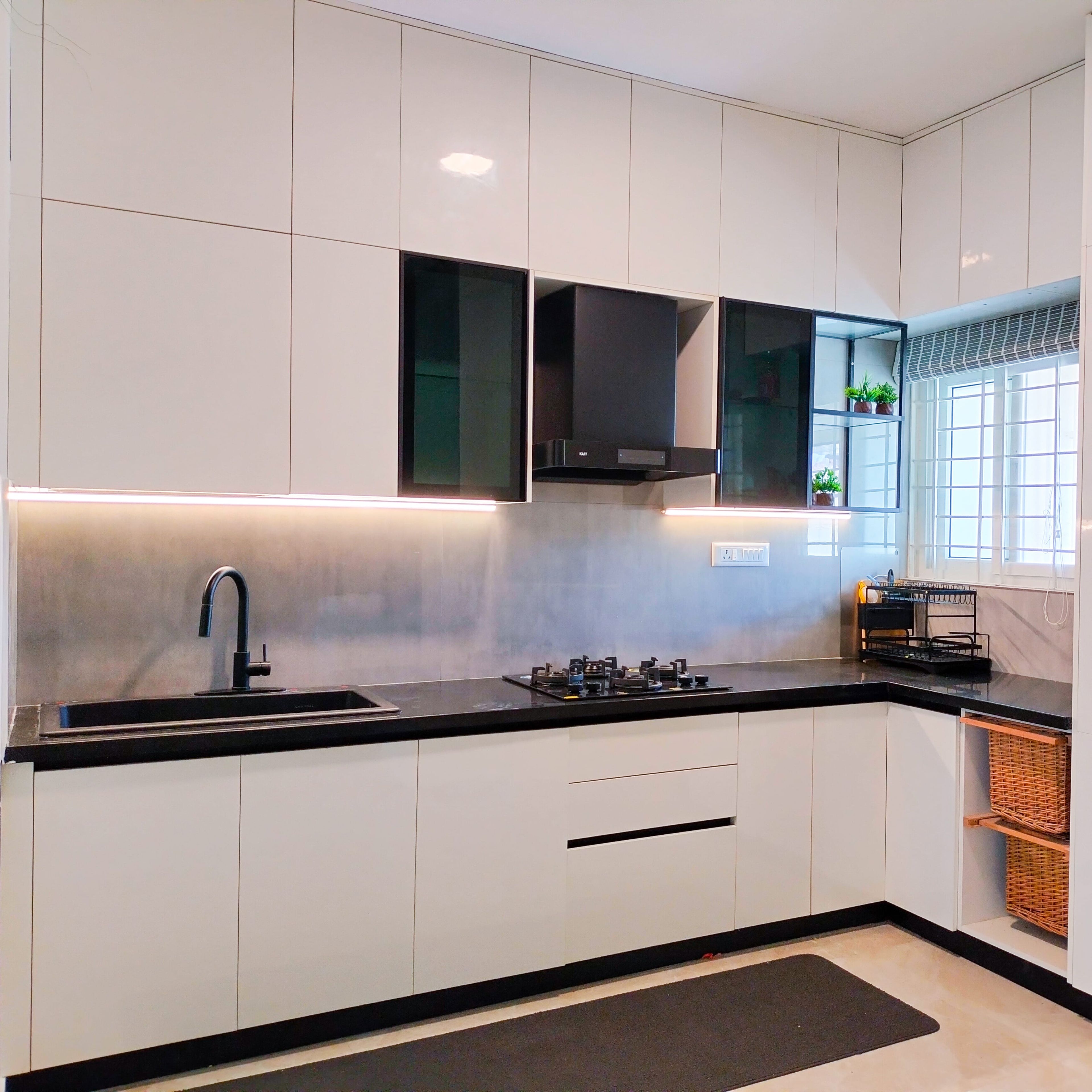 L-Shaped Kitchen Design with White Units and Wicker Baskets