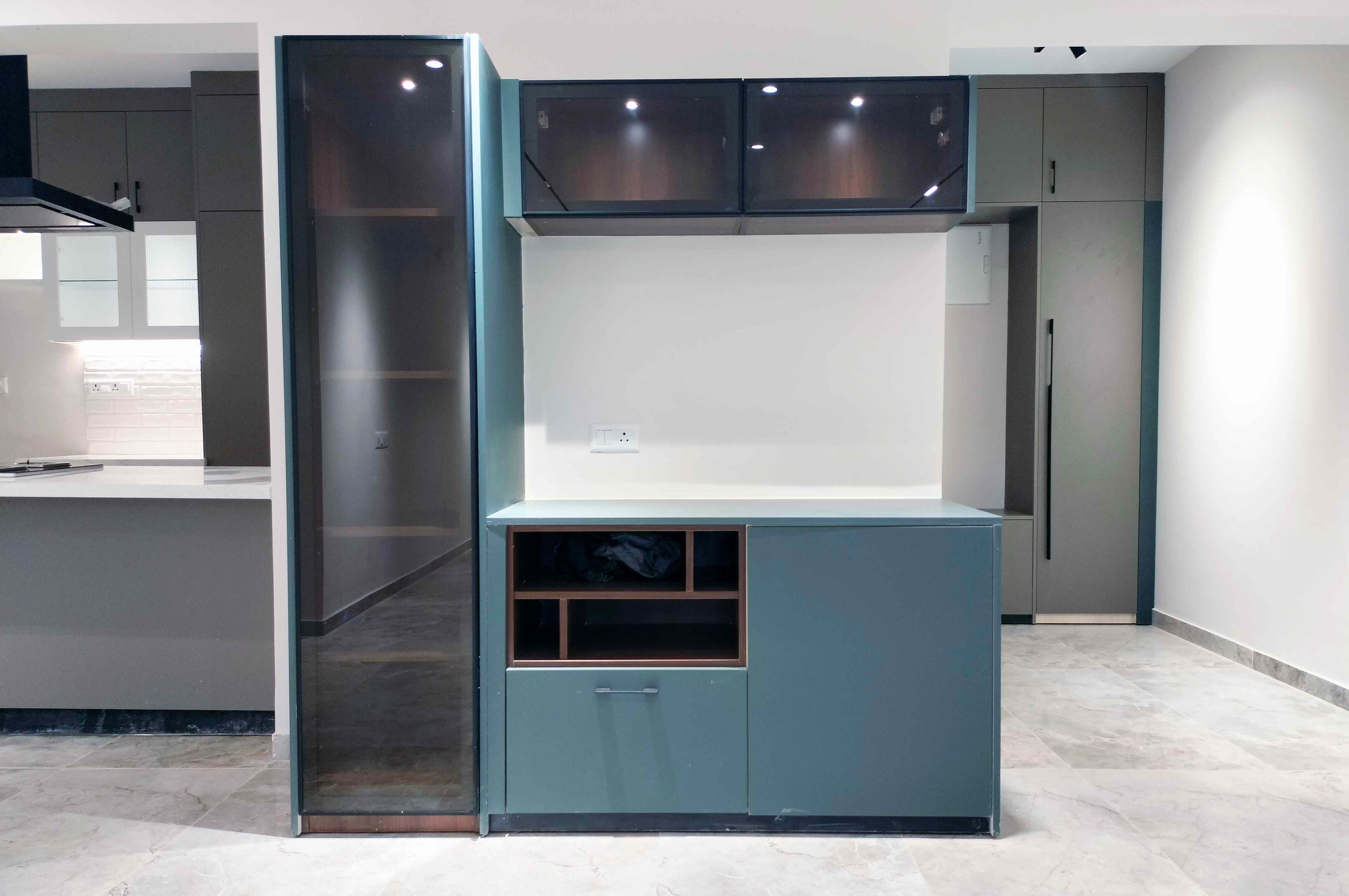 Crockery Unit Design with Blue Cabinets and Glass Shutter Tall and Loft Unit