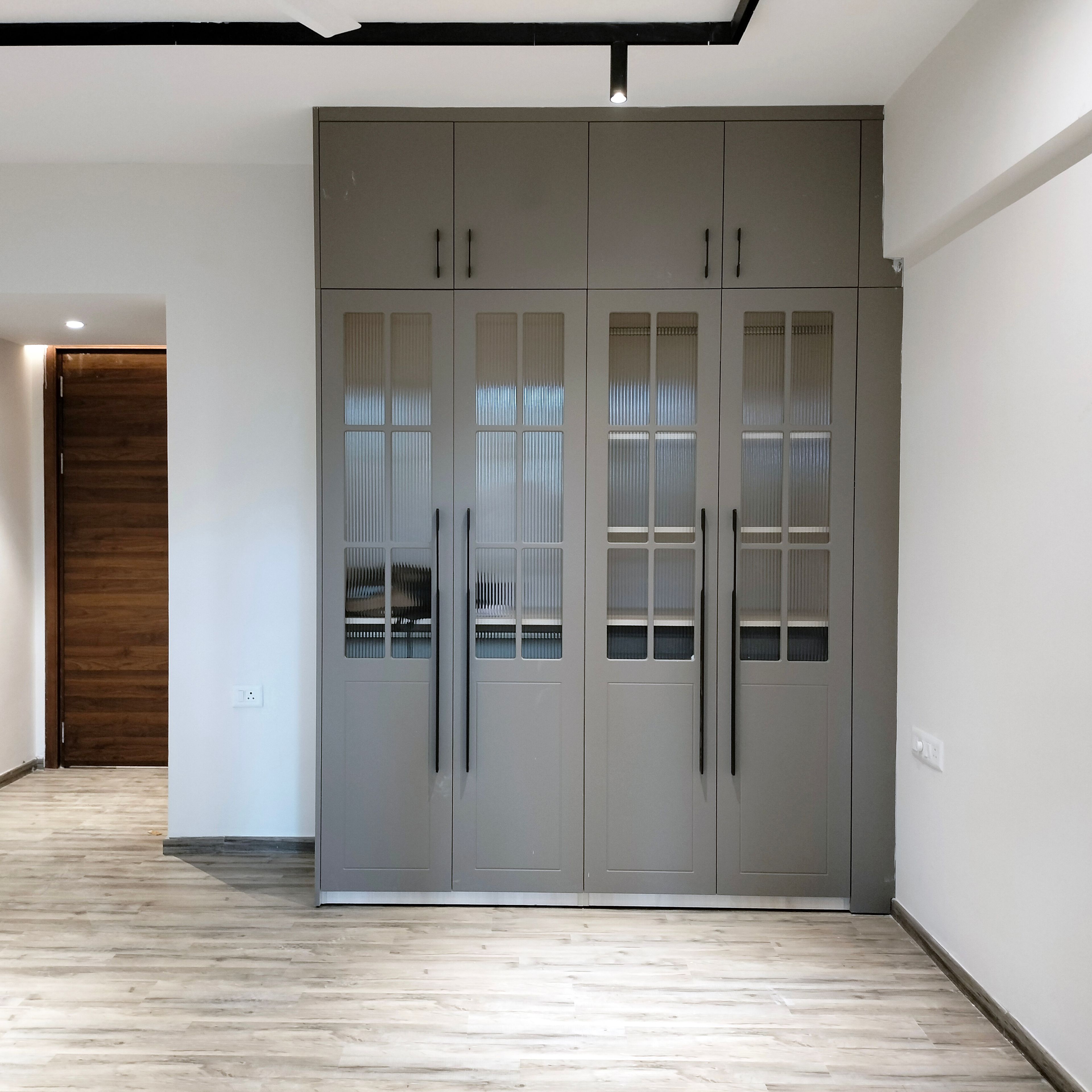 4-Door Grey Profile Frosted Glass Shutter Swing Wardrobe Design