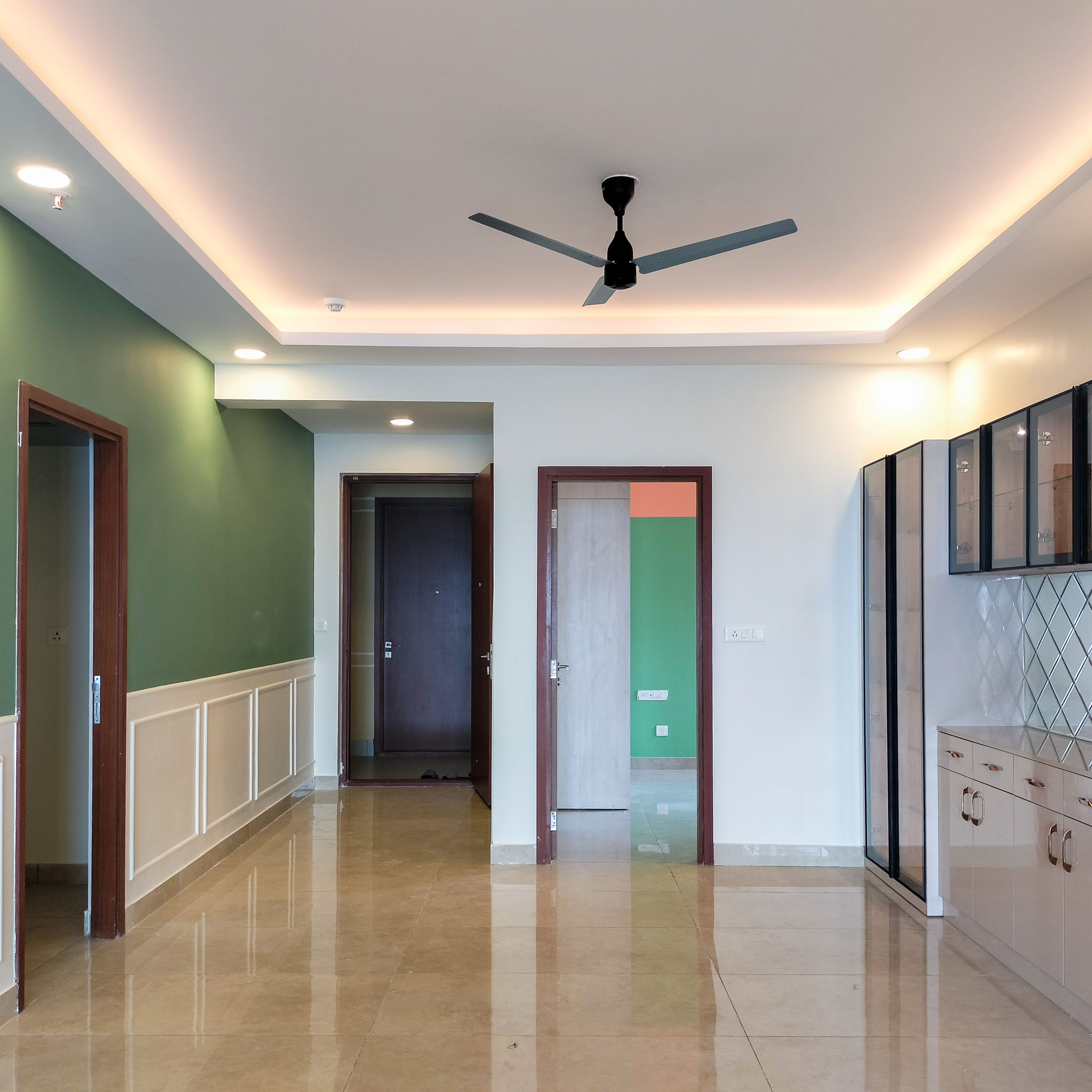 Dining Room Design with Peripheral False Ceiling and Tall Unit