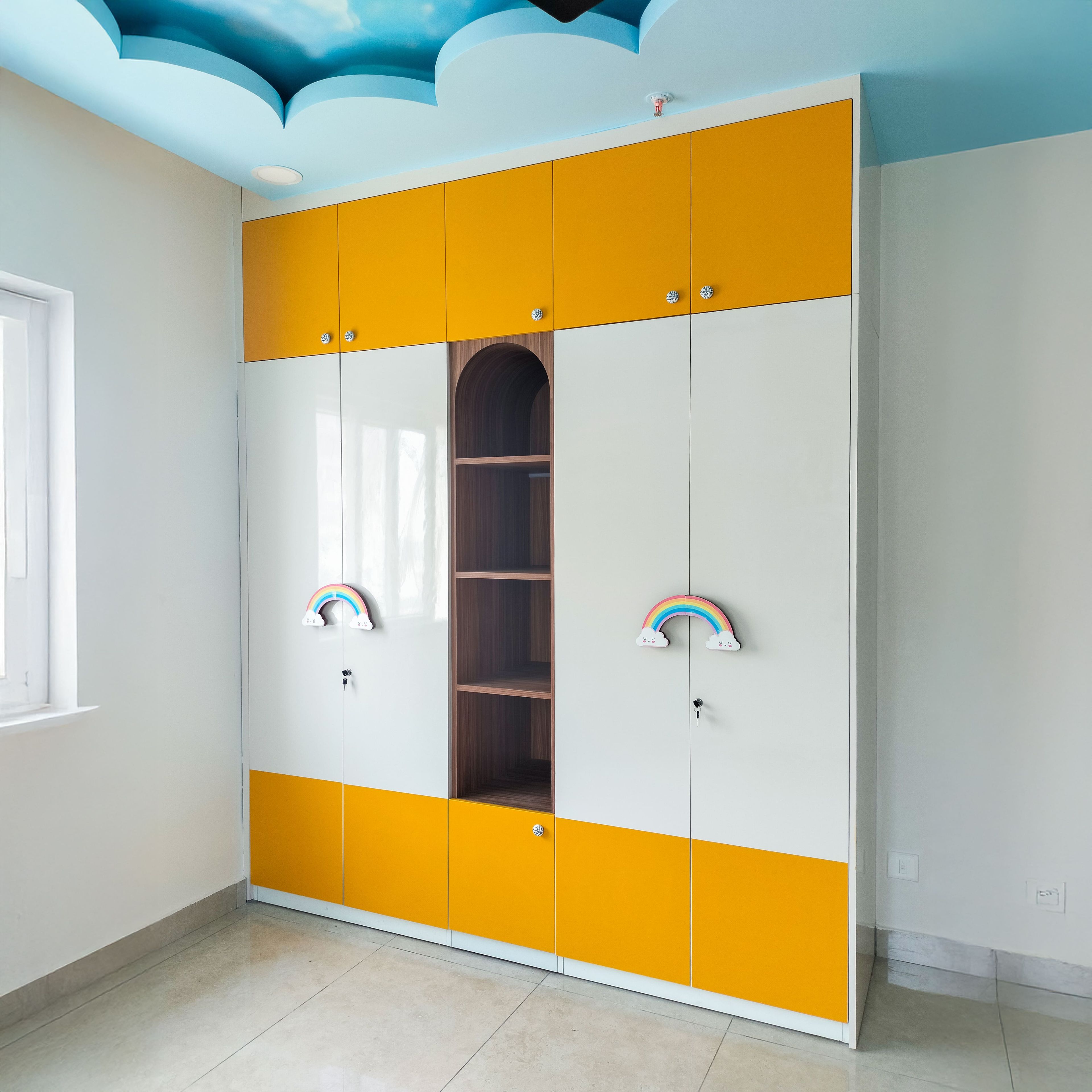 4-Door Yellow and White Swing Wardrobe Design with Rainbow Handles and Cloud Design Peripheral False Ceiling