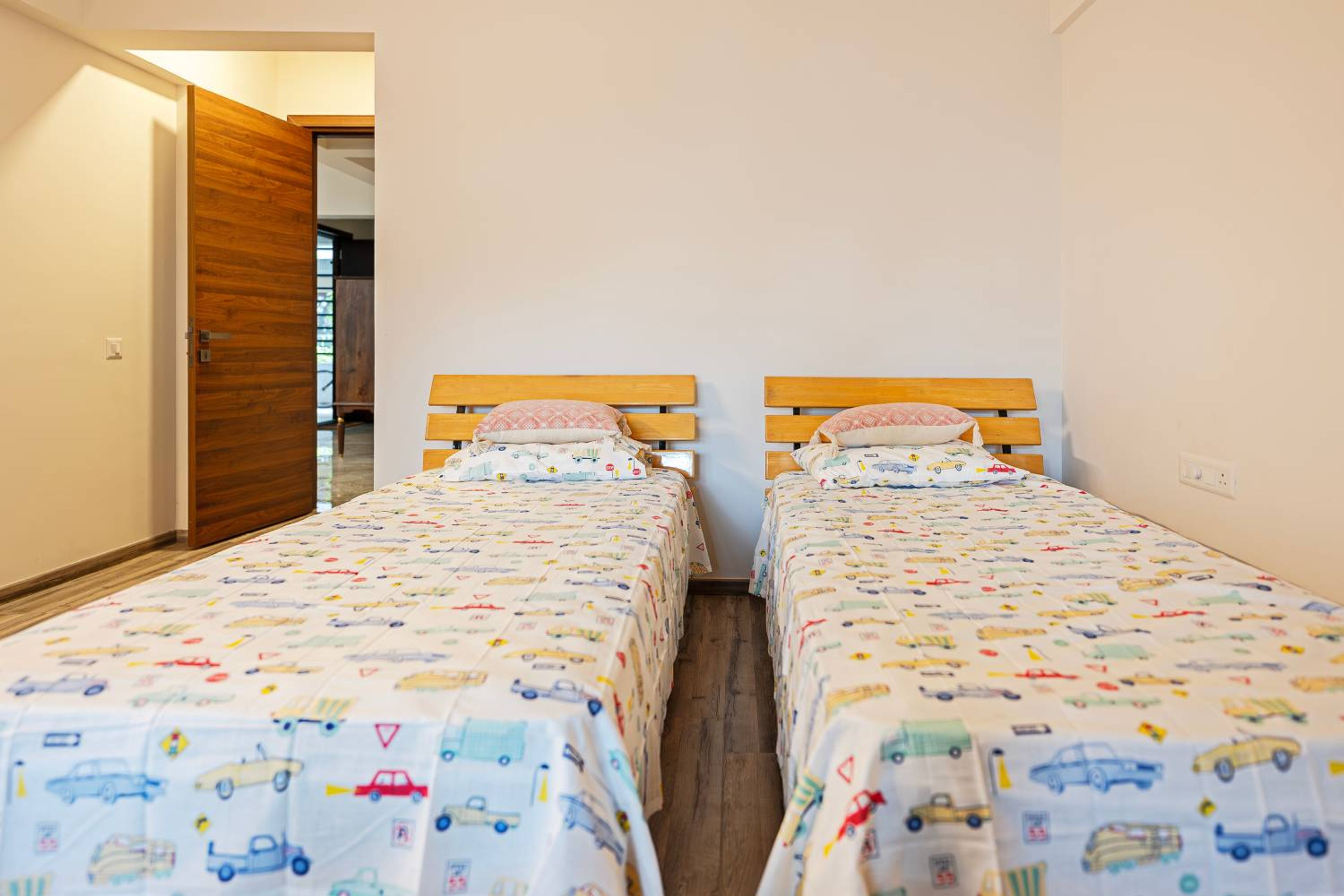 Modern Kids Bedroom Design Featuring Twin Cot Beds and Built-In Wardrobe